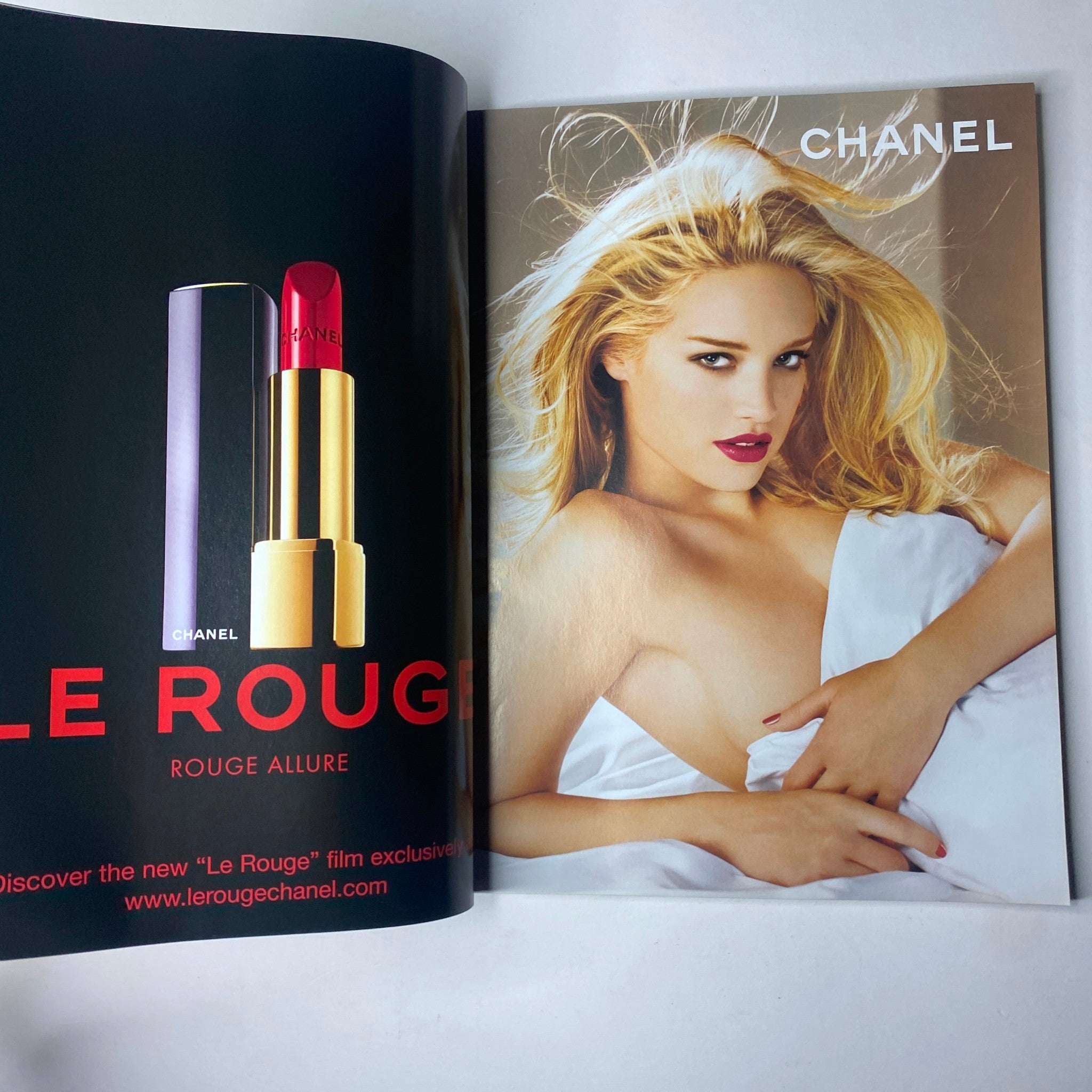 Advertisement page from Vogue British Magazine July 2007 featuring Chanel's 'Le Rouge' lipstick campaign with a stunning model showcasing beauty and glamour.