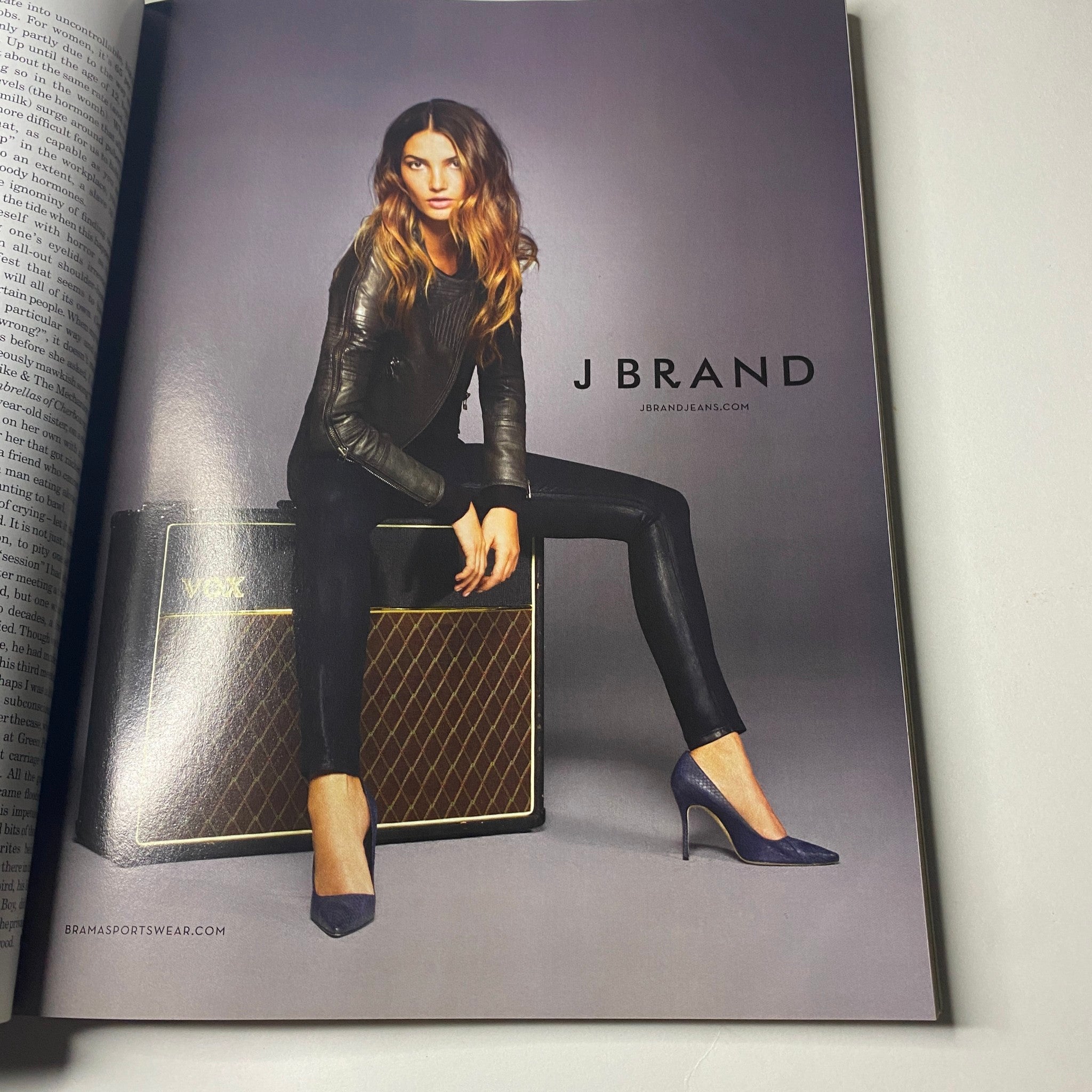 Advertisement in Vogue British Magazine October 2011 for J Brand, featuring stylish model with elegant outfit.