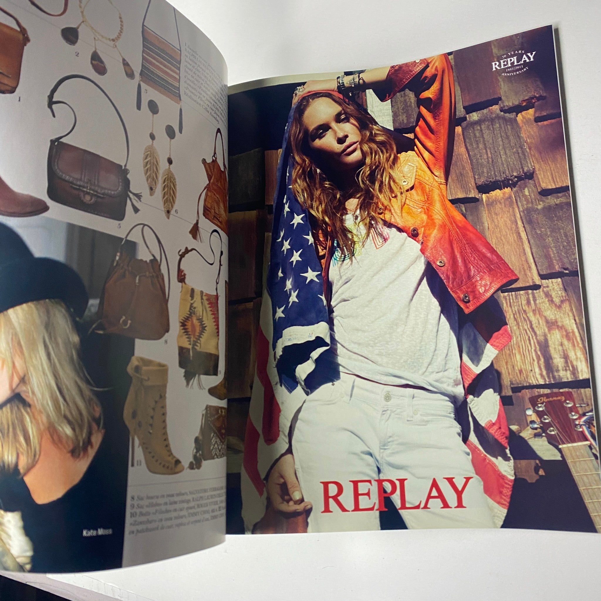 Replay fashion advertisement displaying a model in an American flag jacket, highlighting bags and various accessories, from the Vogue Paris Magazine April 2011 No. 916 Gisele Bündchen Cover.