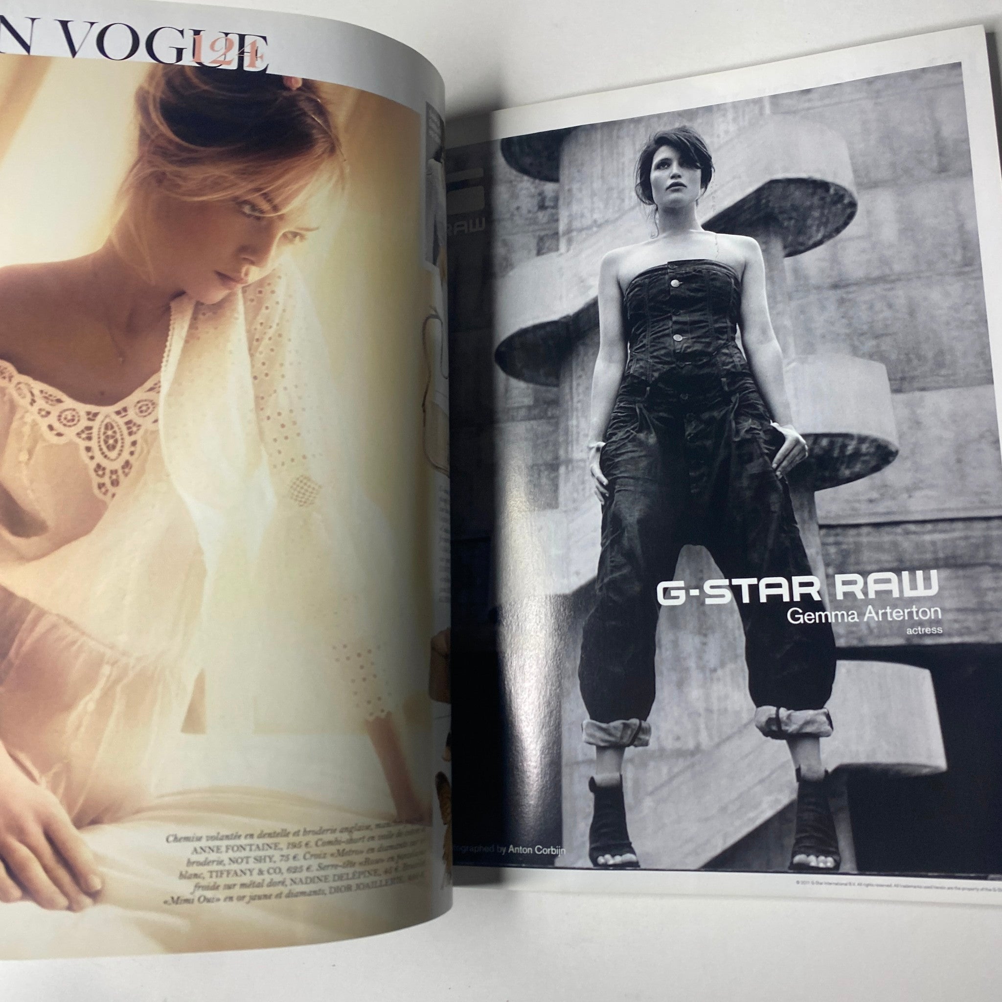 G-Star RAW advertisement featuring model Gemma Arterton in stylish denim wear, captured in an artistic black and white setting, from the Vogue Paris Magazine April 2011 No. 916 Gisele Bündchen Cover.