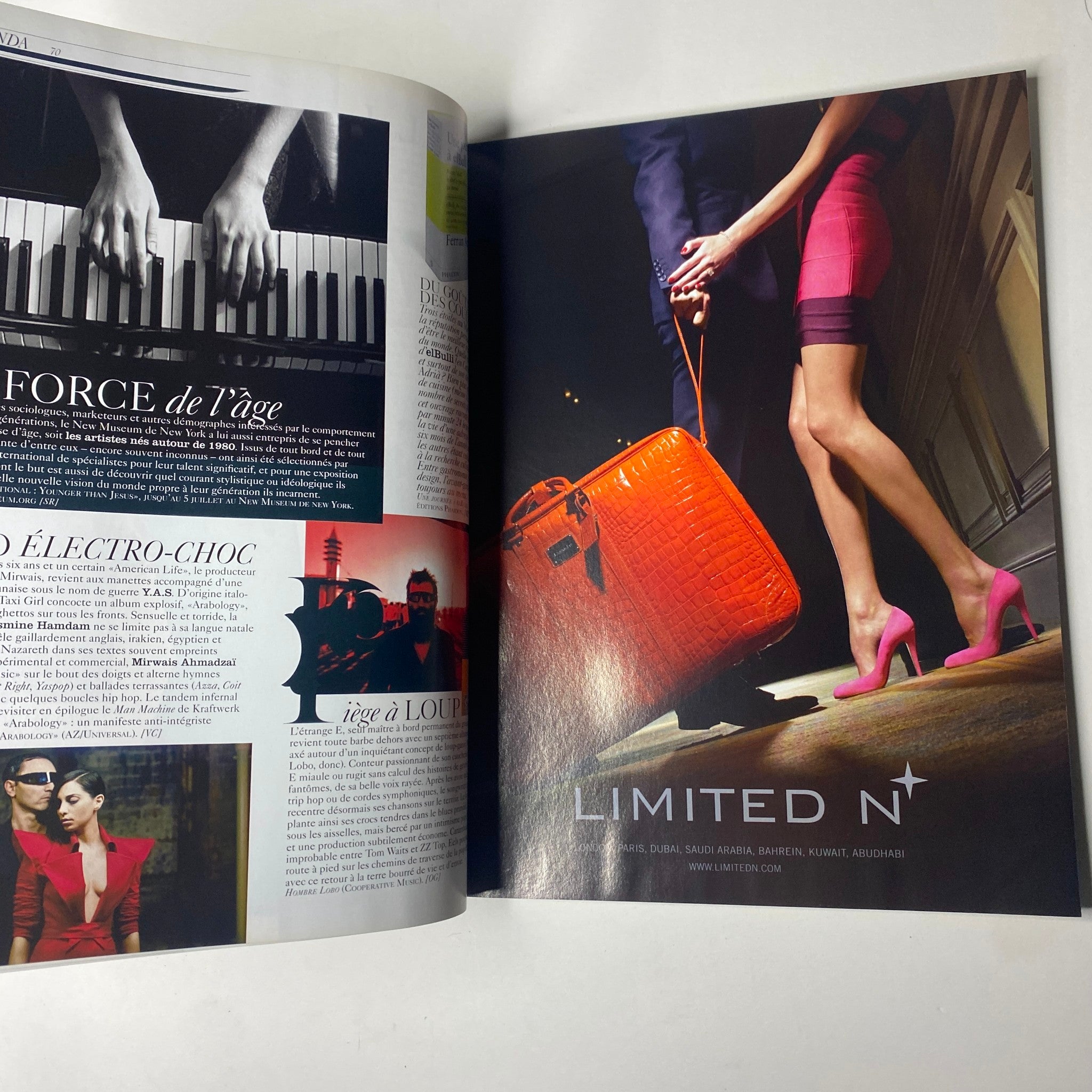 Advert page from Vogue Paris Magazine June - July 2009 No. 898 showcasing a bold red handbag and stylish outfits.