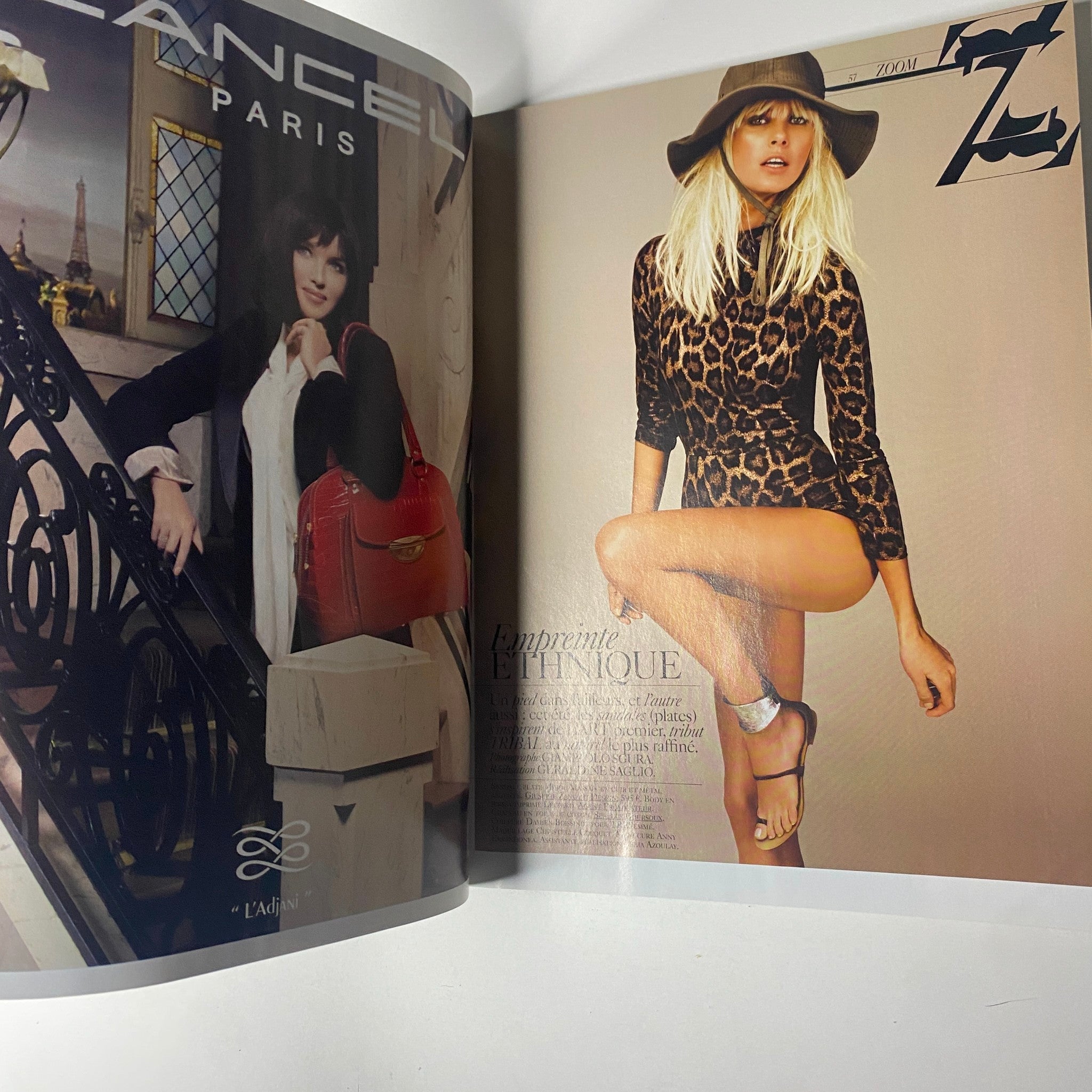 Interior page of Vogue Paris Magazine June - July 2009 No. 898 displaying a fashion editorial with a model in leopard print.