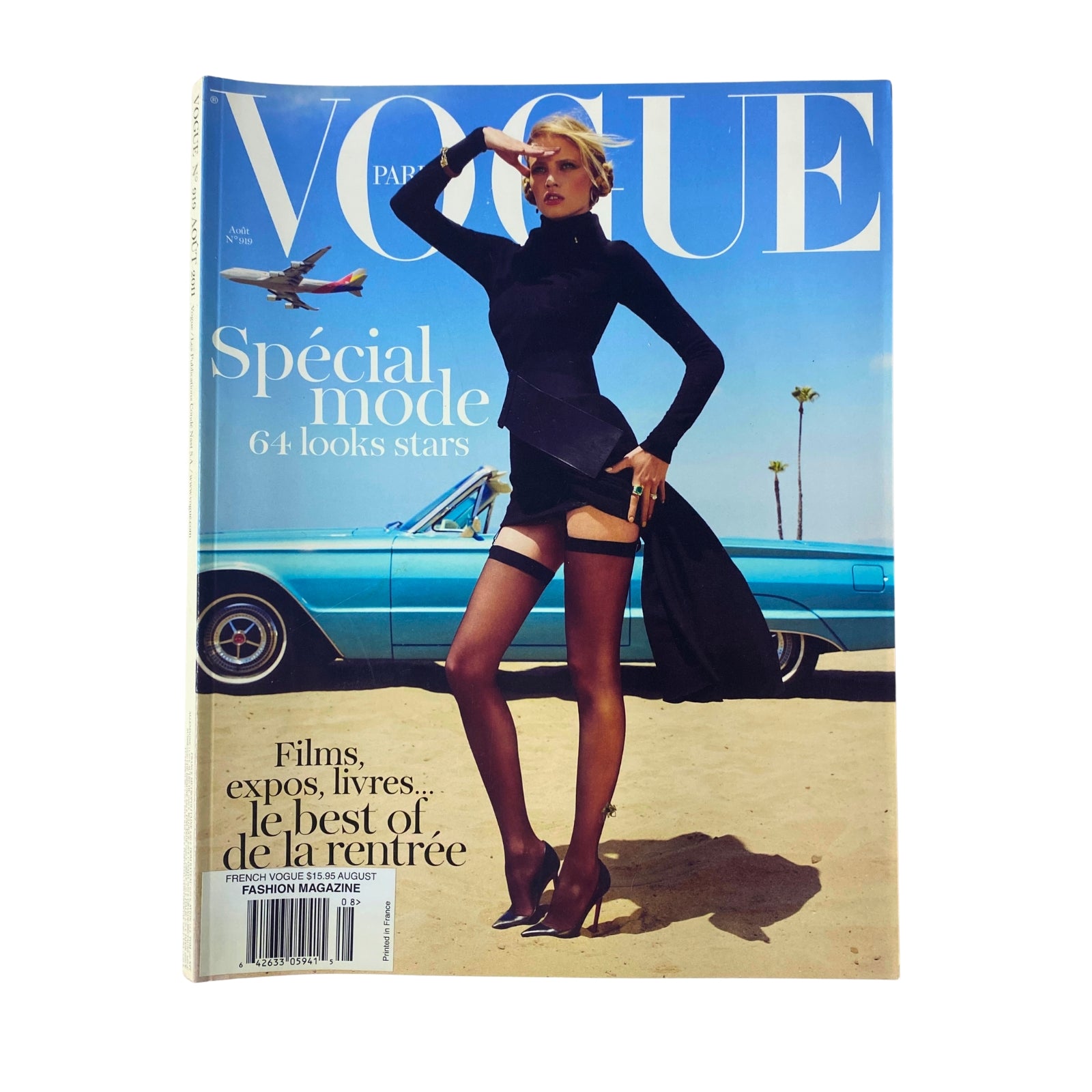 Vogue Paris Magazine August 2011 No. 919 featuring a stylish model in an elegant black outfit against a sunny backdrop with a classic car. Great for collectors and fashion enthusiasts.