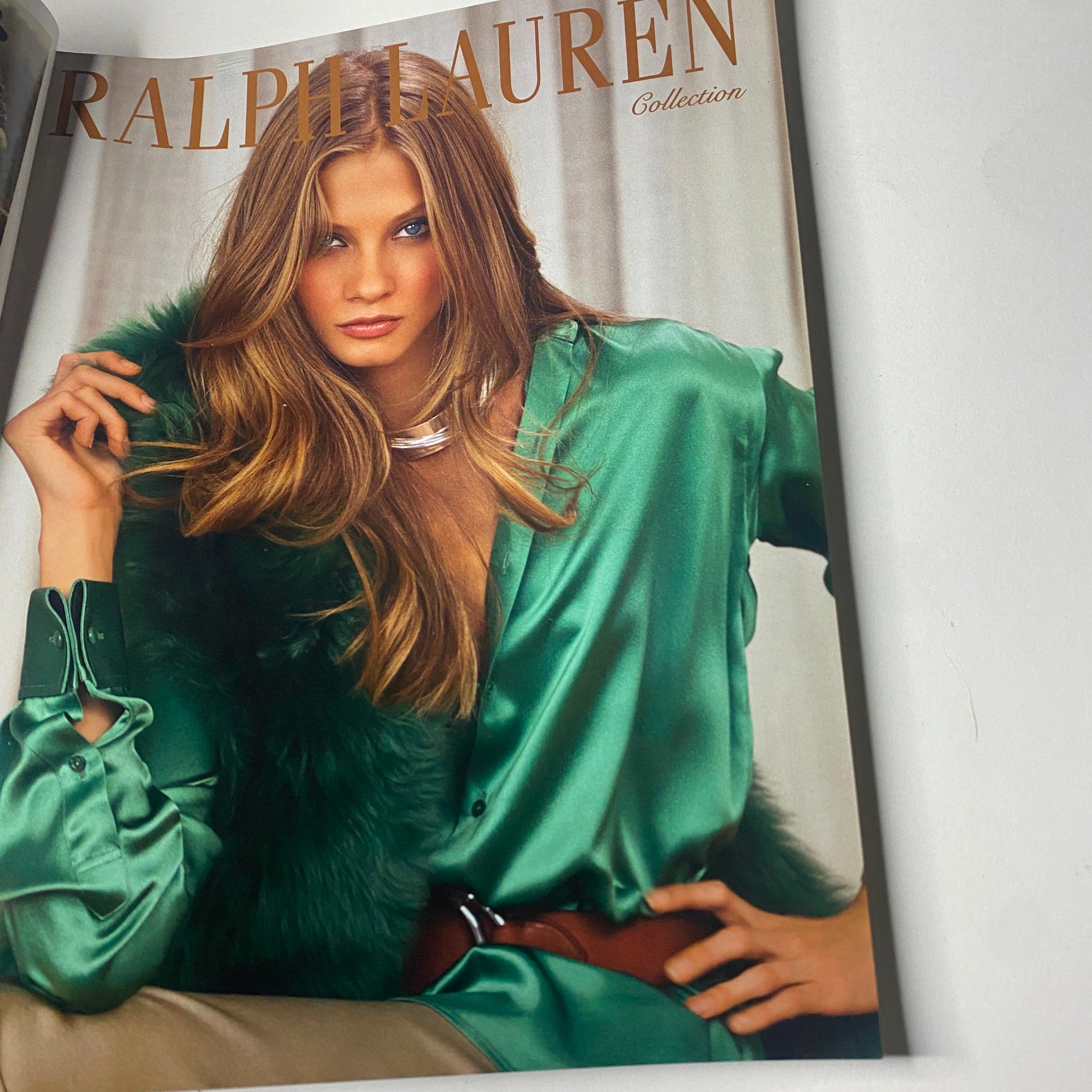 Ralph Lauren Collection advertisement featuring a model in a luxurious green blouse, showcasing high-fashion style from Vogue Paris Magazine February 2012 No. 924.