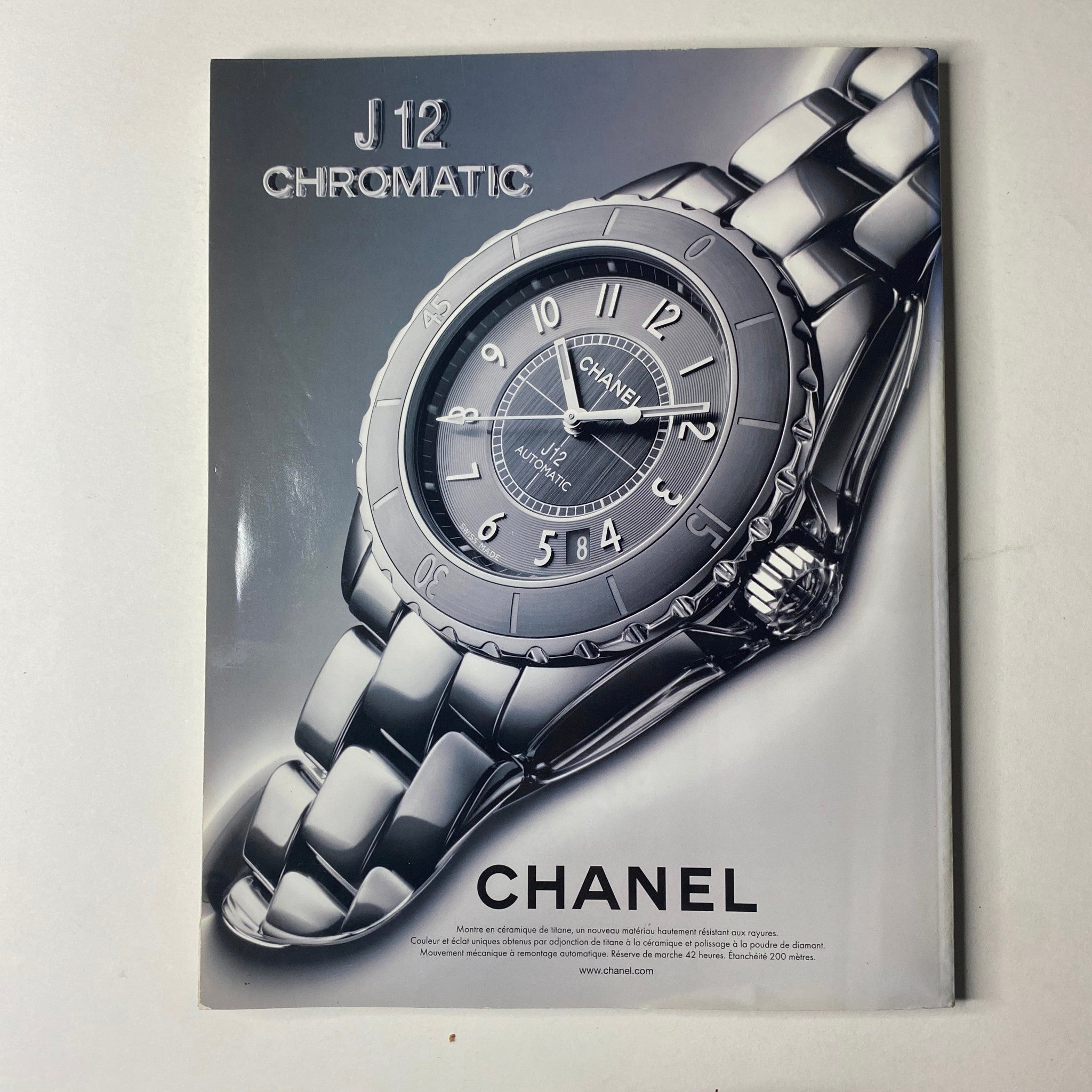 Chanel J12 Chromatic watch advertisement from Vogue Paris Magazine November 2011 No. 922, featuring the luxurious timepiece elegantly displayed.