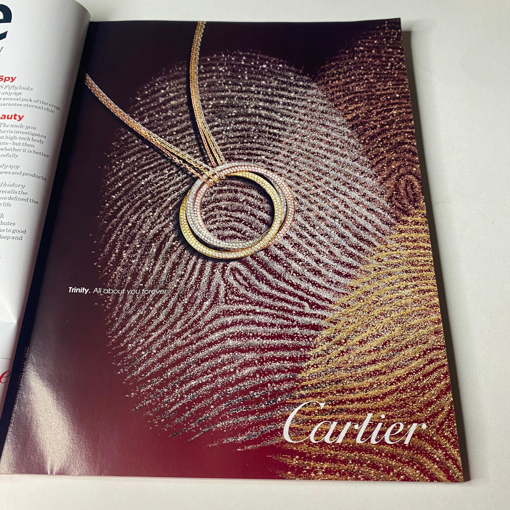 Cartier jewelry advertisement featuring a sparkling necklace design, showcasing a fingerprint pattern, from Vogue British Magazine July 2011 Vanessa Paradis Cover No Label VG.
