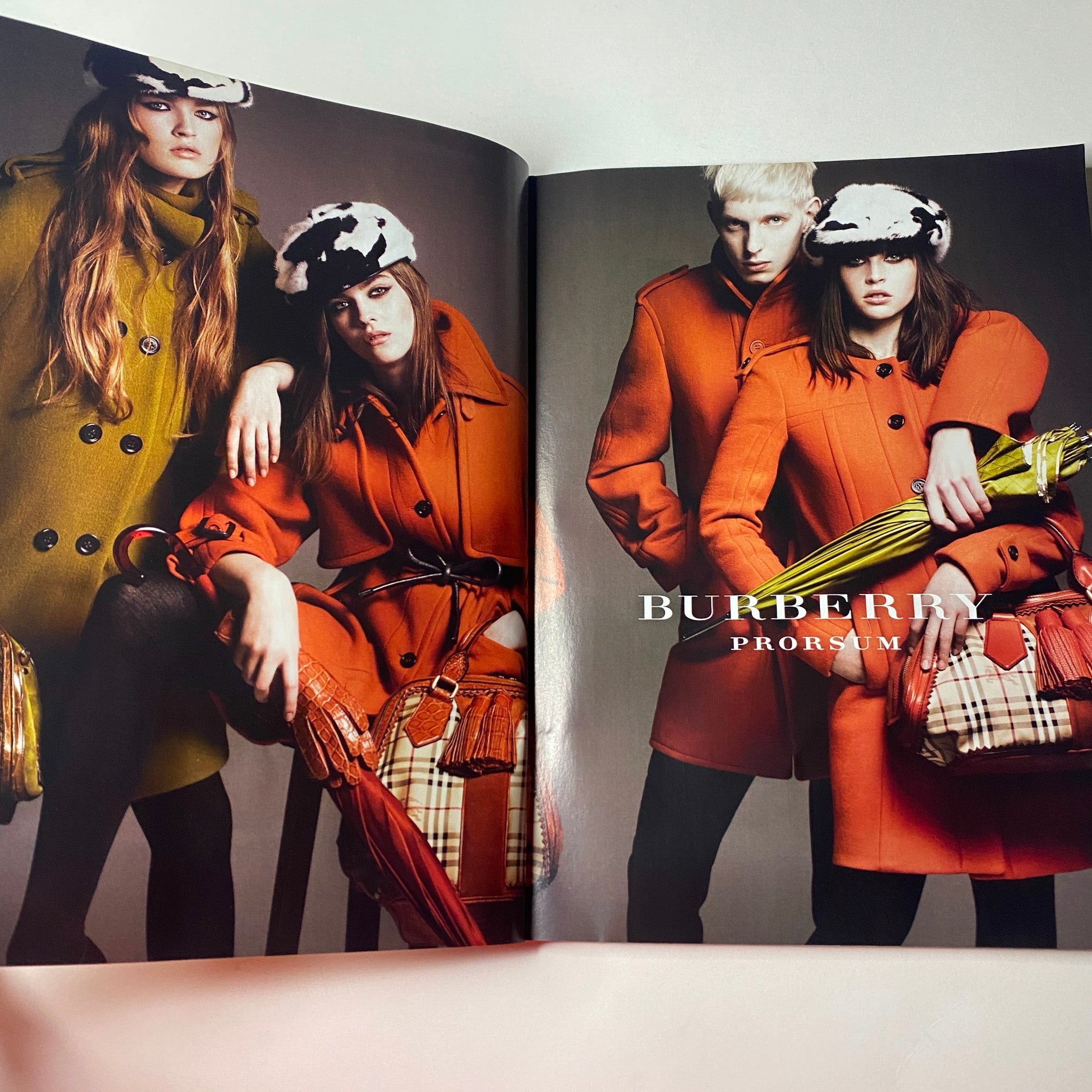 Burberry Prorsum fashion editorial featuring models in vibrant overcoats and accessories, from Vogue British Magazine July 2011 Vanessa Paradis Cover No Label VG.
