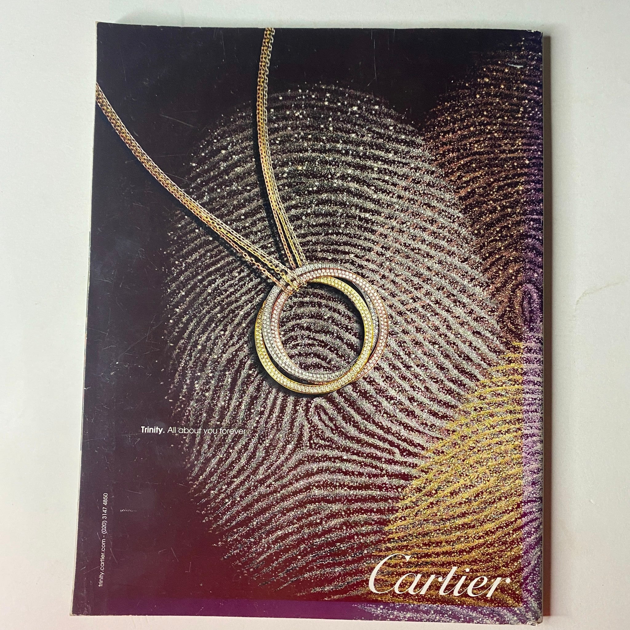 Luxury jewelry advertisement for Cartier from Vogue British Magazine June 2011, featuring a stunning necklace design.
