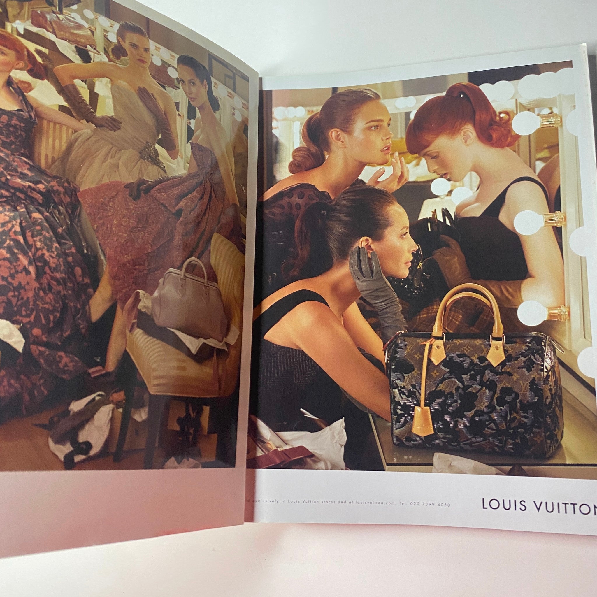 Fashion advertisement featuring models in elegant dresses and Louis Vuitton bags, from Vogue British Magazine November 2010.