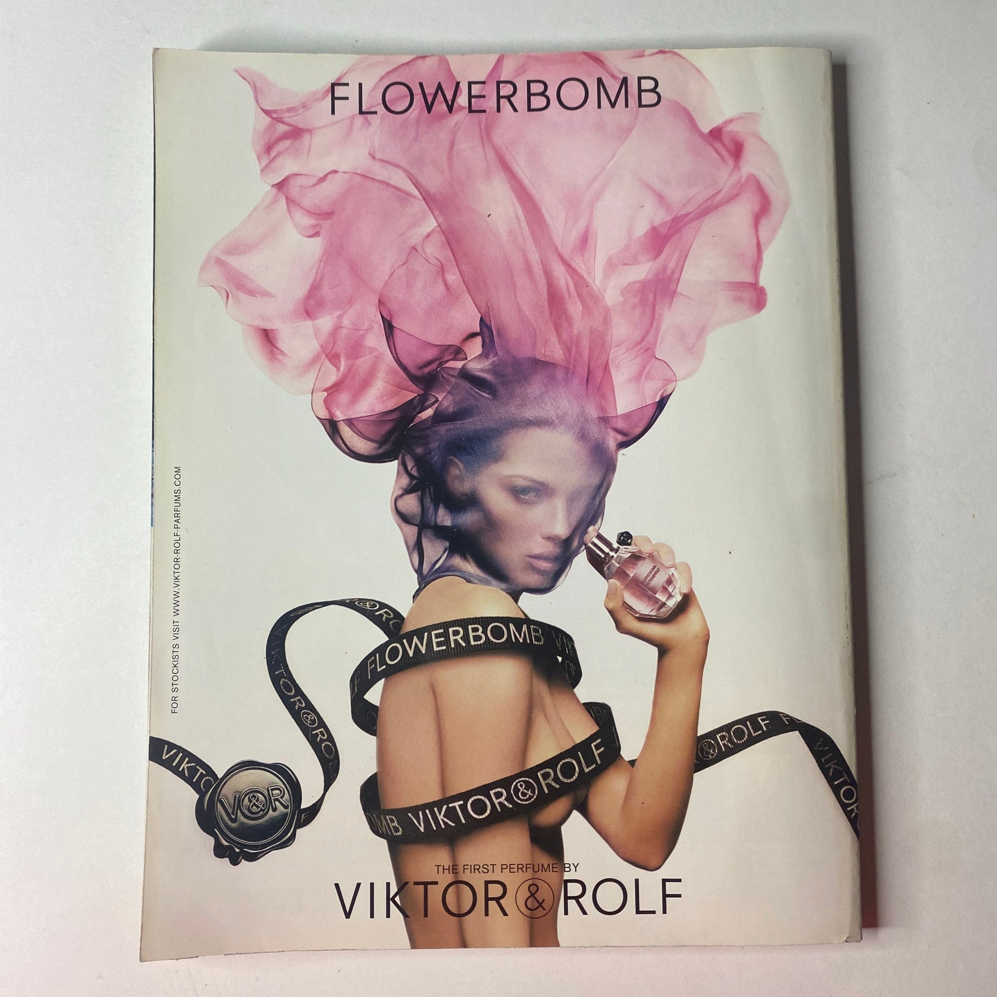 Advertisement for Flowerbomb perfume by Viktor & Rolf, showcasing an artistic image, from Vogue British Magazine November 2010.