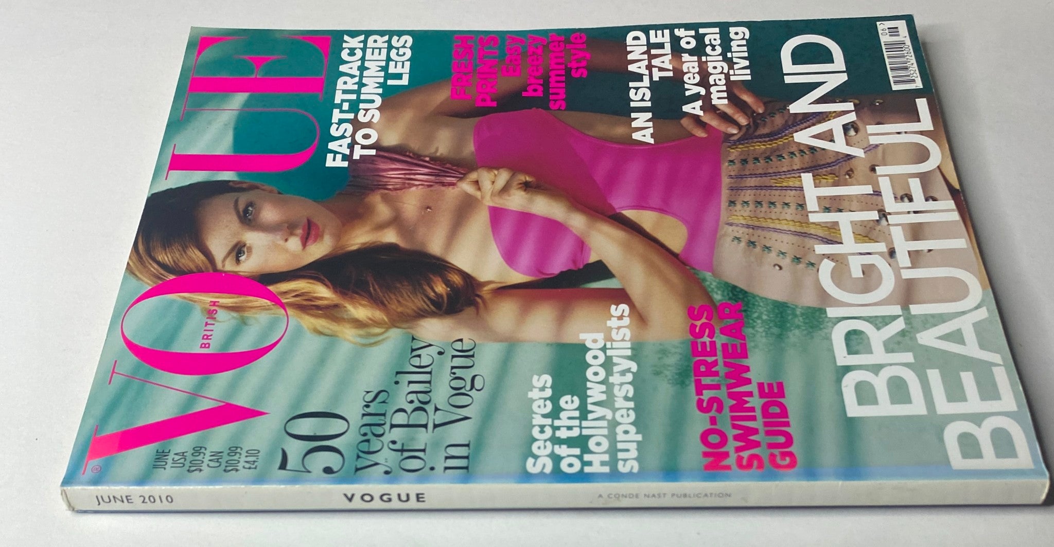 Side view of the Vogue British Magazine June 2010 featuring Angela Lindvall, emphasizing content such as summer fashion trends and lifestyle insights. Cover details include 'Fast-Track to Summer Legs' and 'No-Stress Swimwear Guide.'