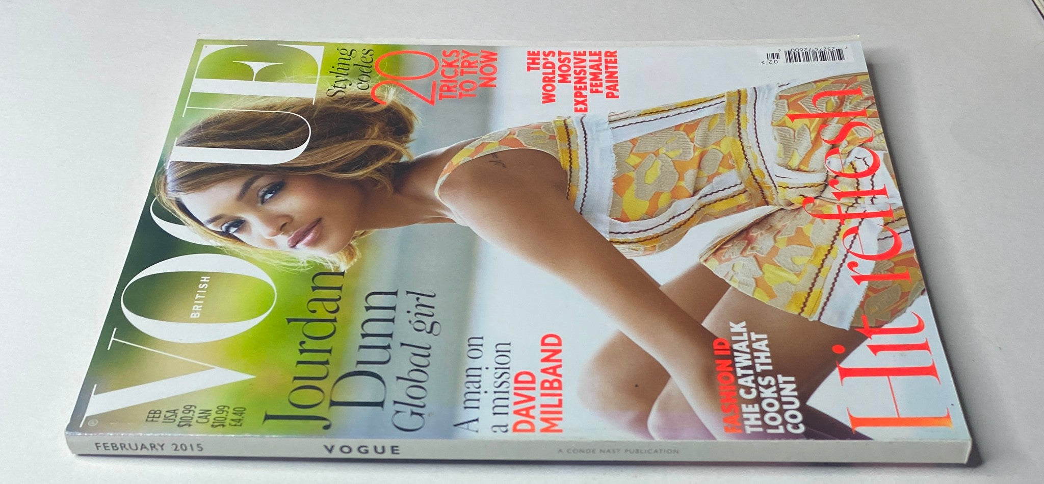 Side view of the February 2015 issue of Vogue British Magazine showcasing Jourdan Dunn on the cover, emphasizing fashion trends and celebrity interviews.