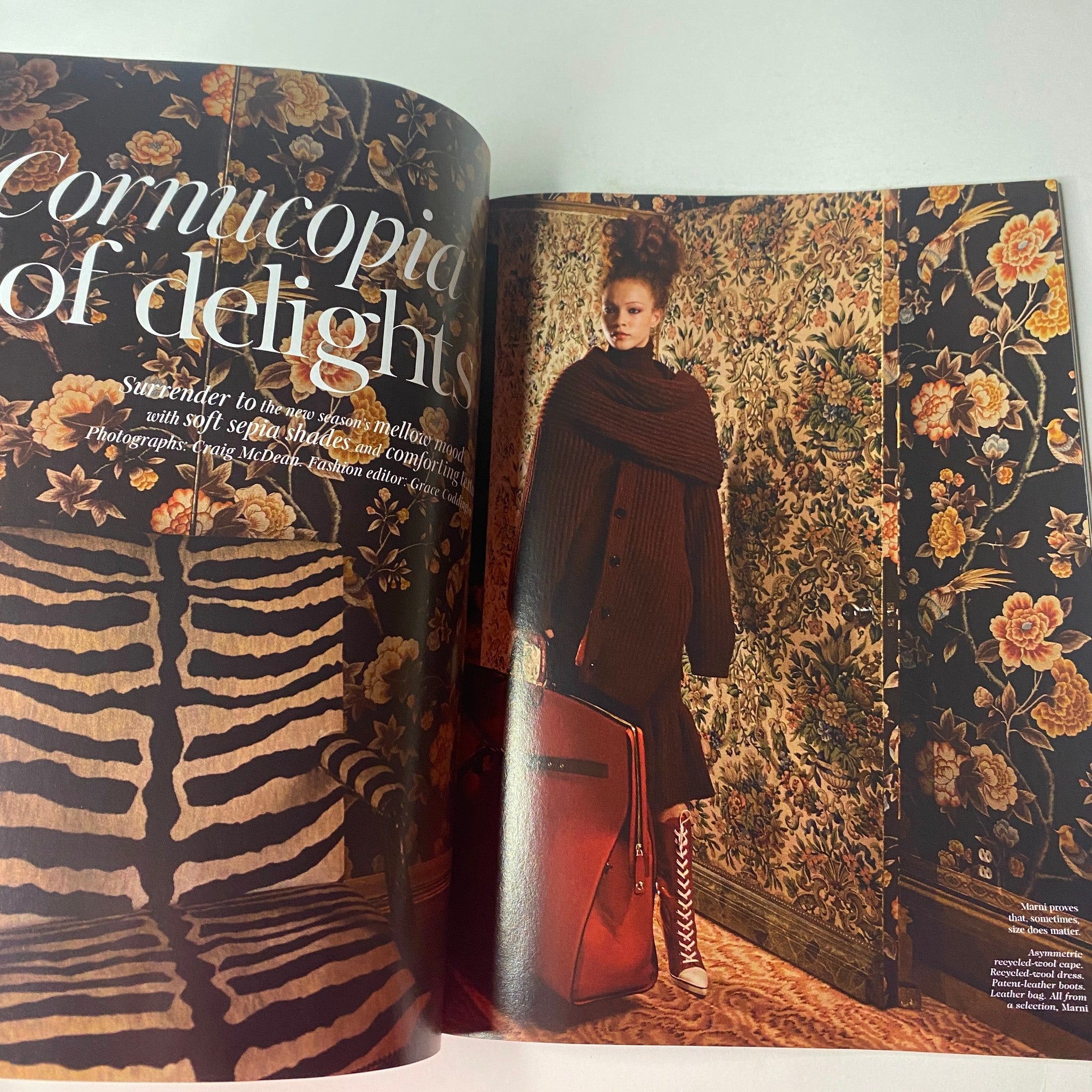 Fashion editorial titled 'Cornucopia of Delights' featuring a model in a stylish outfit against a floral wallpaper background. Title: Vogue British Magazine August 2021 Margot Robbie Cover No Label VG.