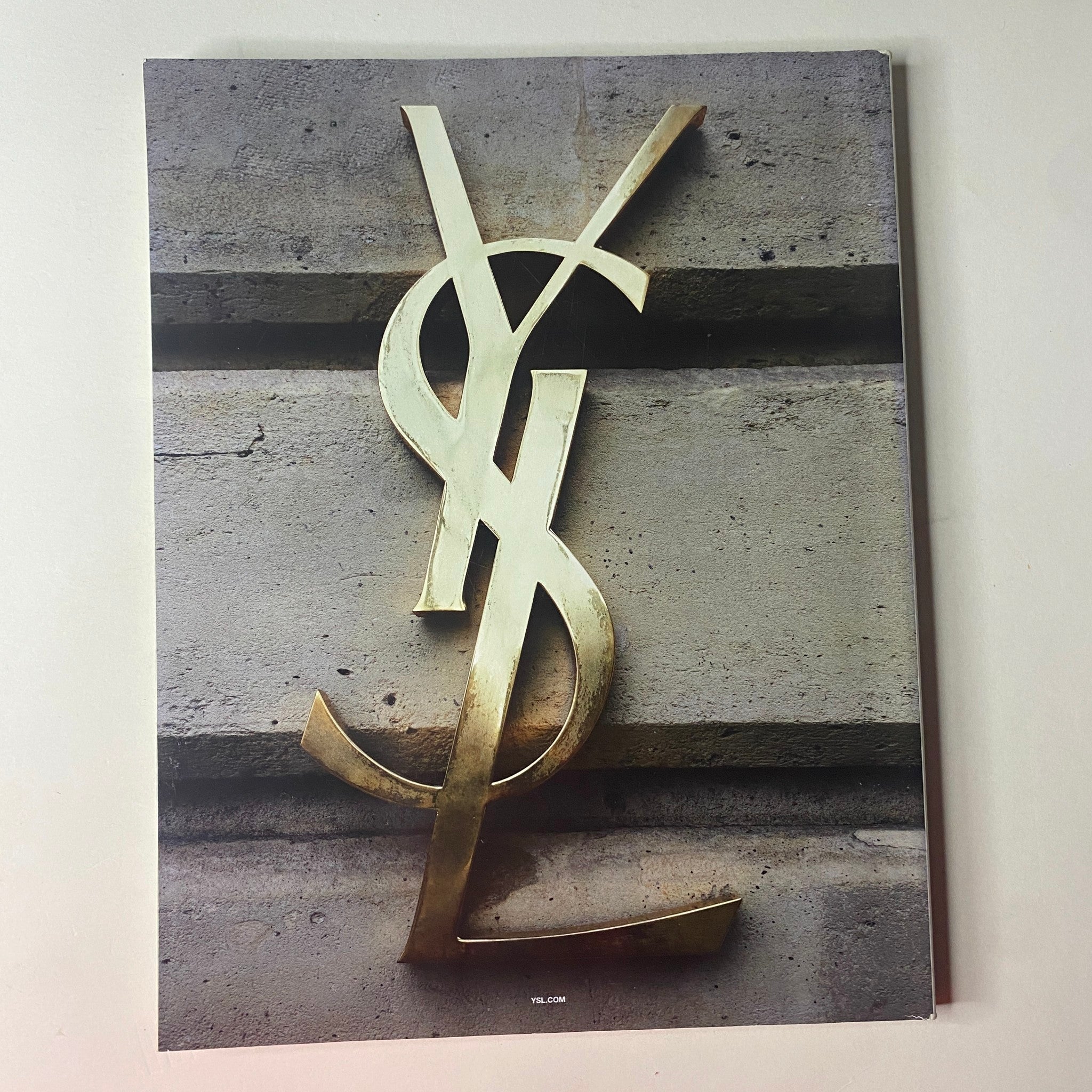 YSL logo image featured in Vogue British Magazine August 2021 with a minimalistic background. Title: Vogue British Magazine August 2021 Margot Robbie Cover No Label VG.