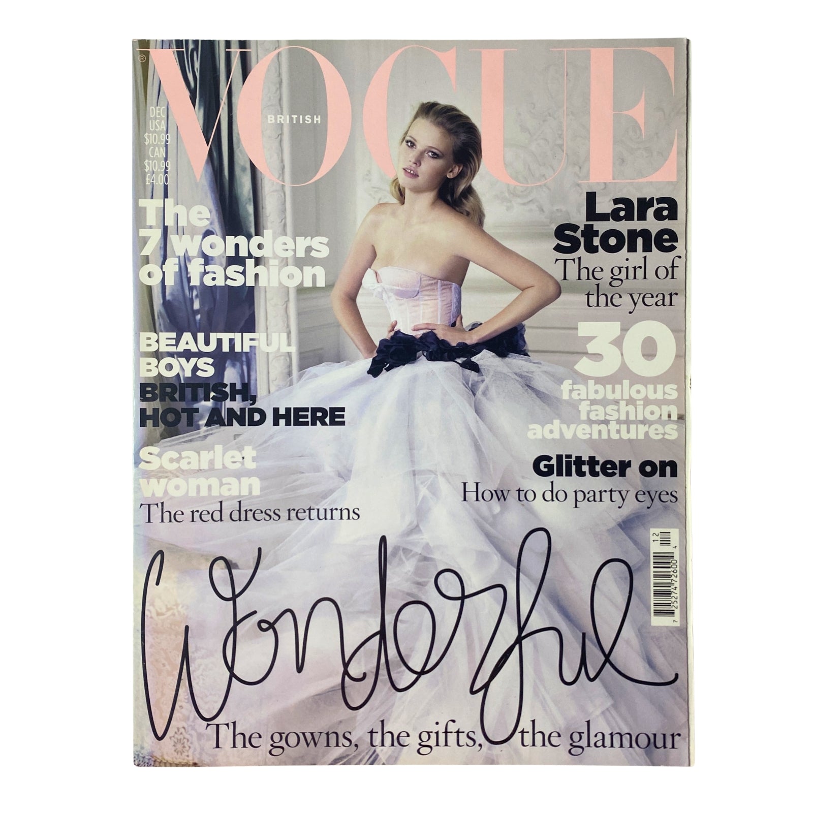 Cover of Vogue British Magazine December 2009 featuring Lara Stone, titled 'The Girl of the Year', showcasing a glamorous editorial with a tulle gown and festive design elements.