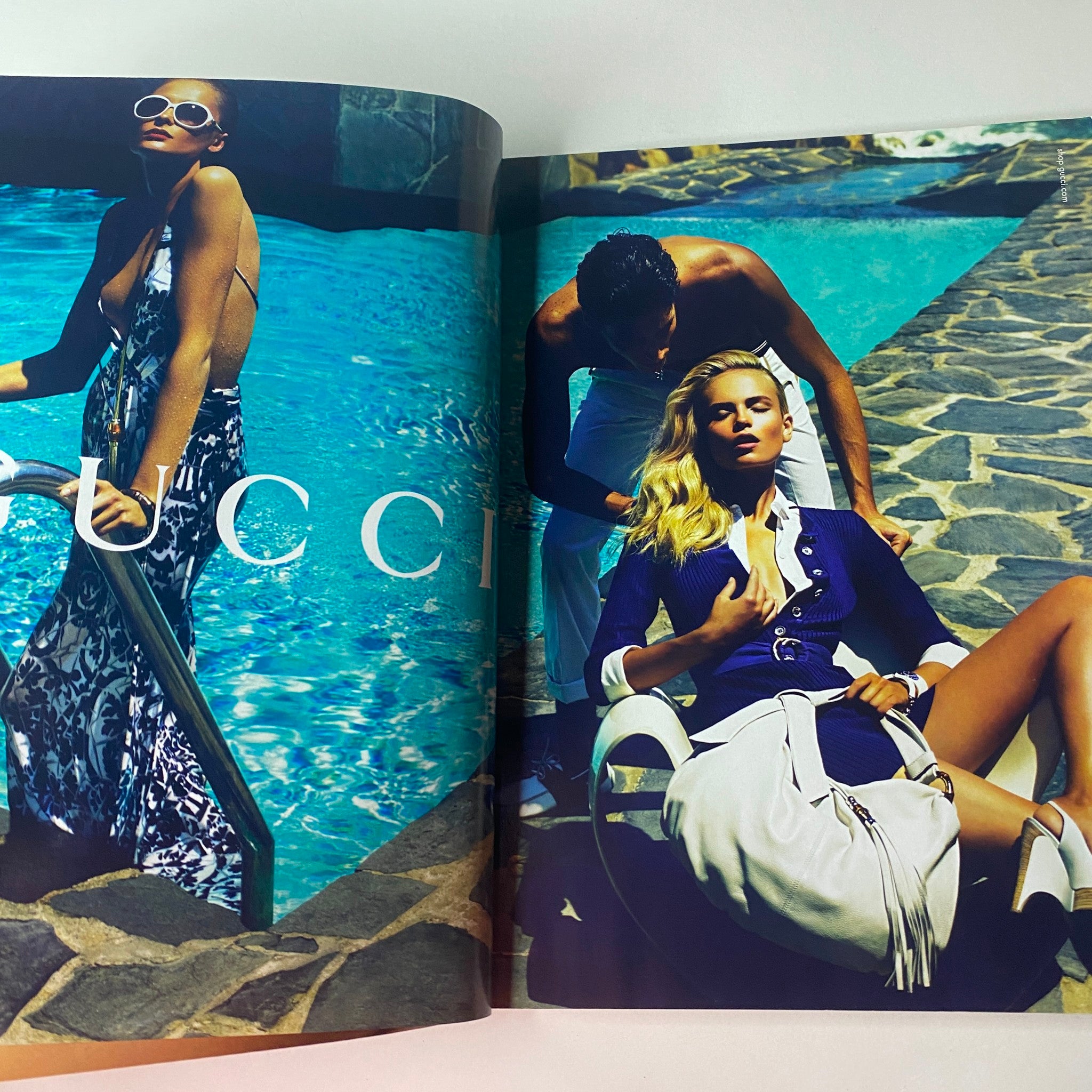Vogue British Magazine December 2009 featuring Lara Stone on the cover with a striking GUCCI fashion spread by the pool. Ideal for fashion enthusiasts and collectors.