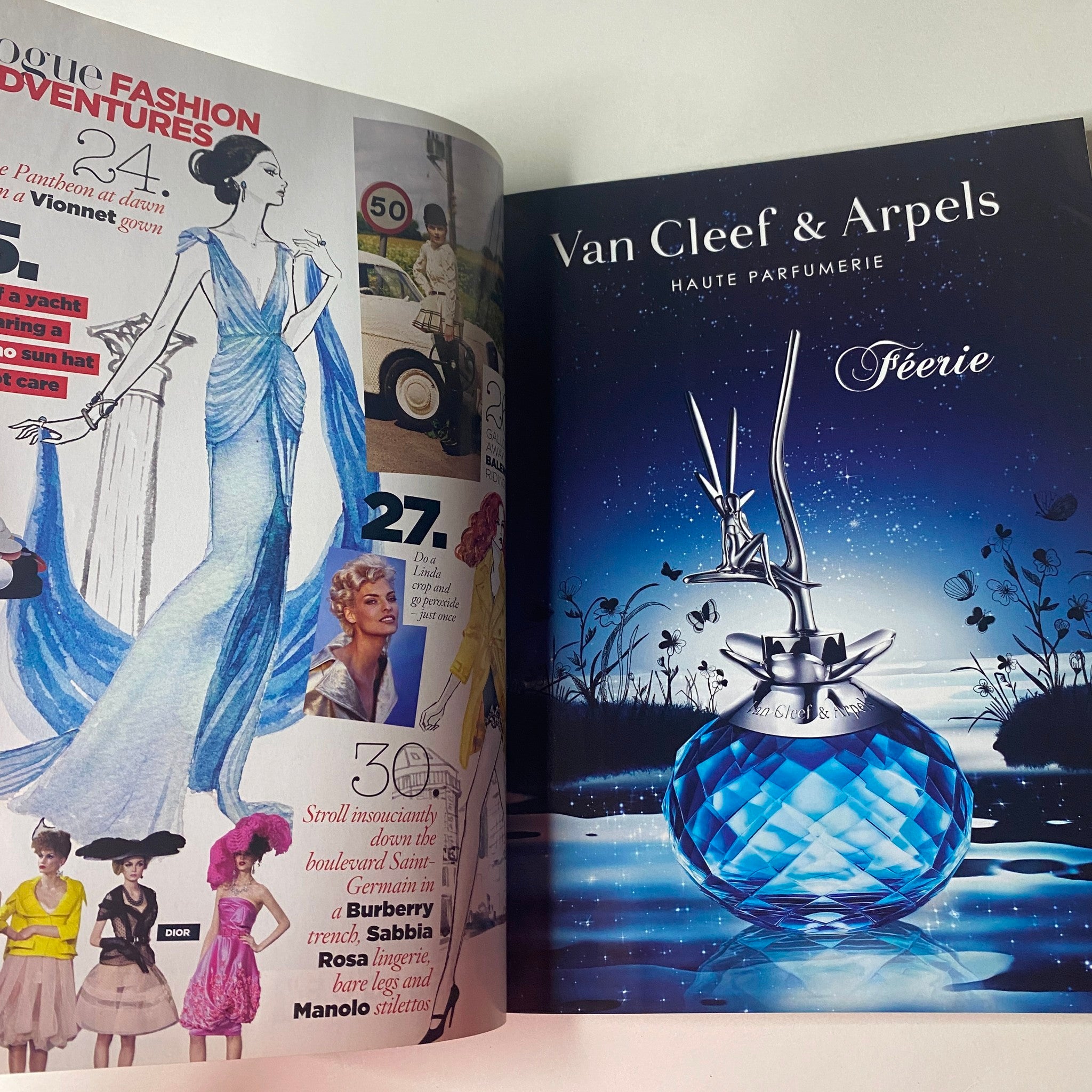 Inside Vogue British Magazine December 2009 showcasing an artistic Van Cleef & Arpels advertisement for the fragrance Féerie, set against a starry night.
