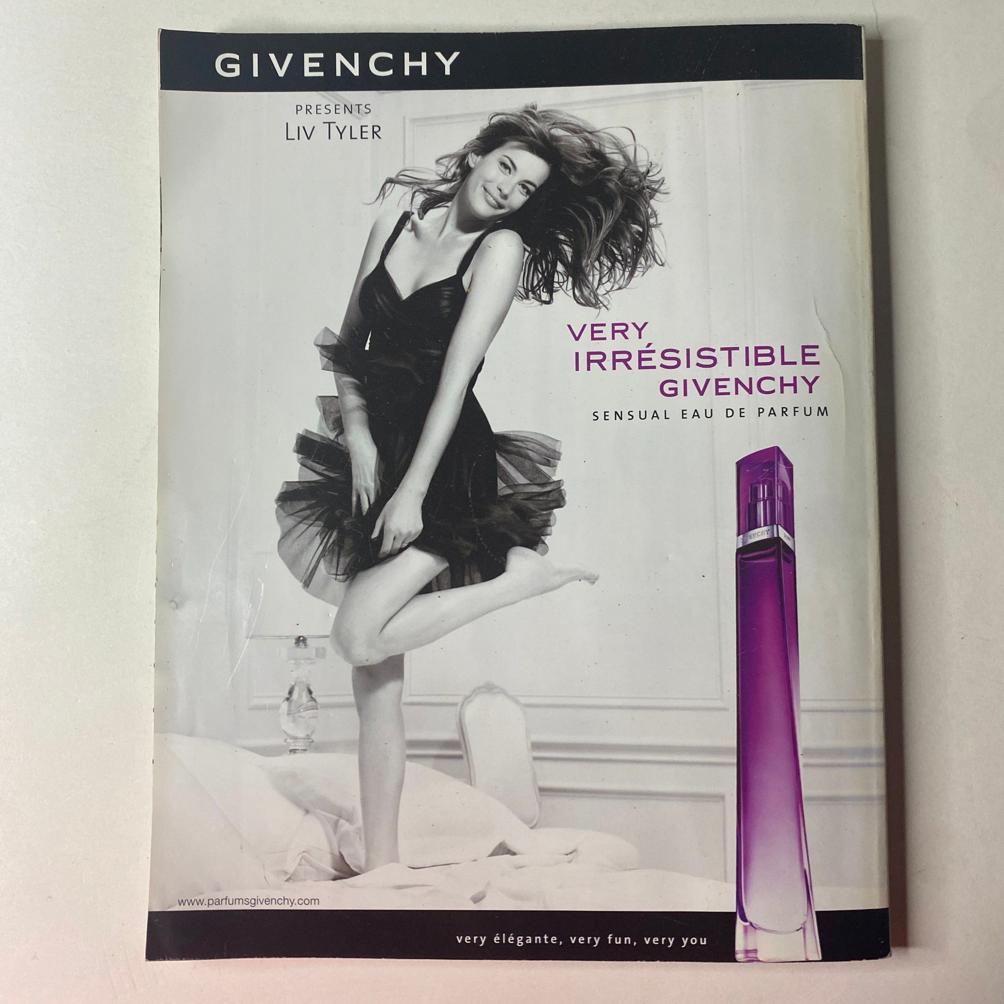 Vogue British Magazine June 2008 Agyness Deyn Cover presents a Givenchy fragrance advertisement featuring Liv Tyler, exuding sensuality and style with a playful aesthetic.