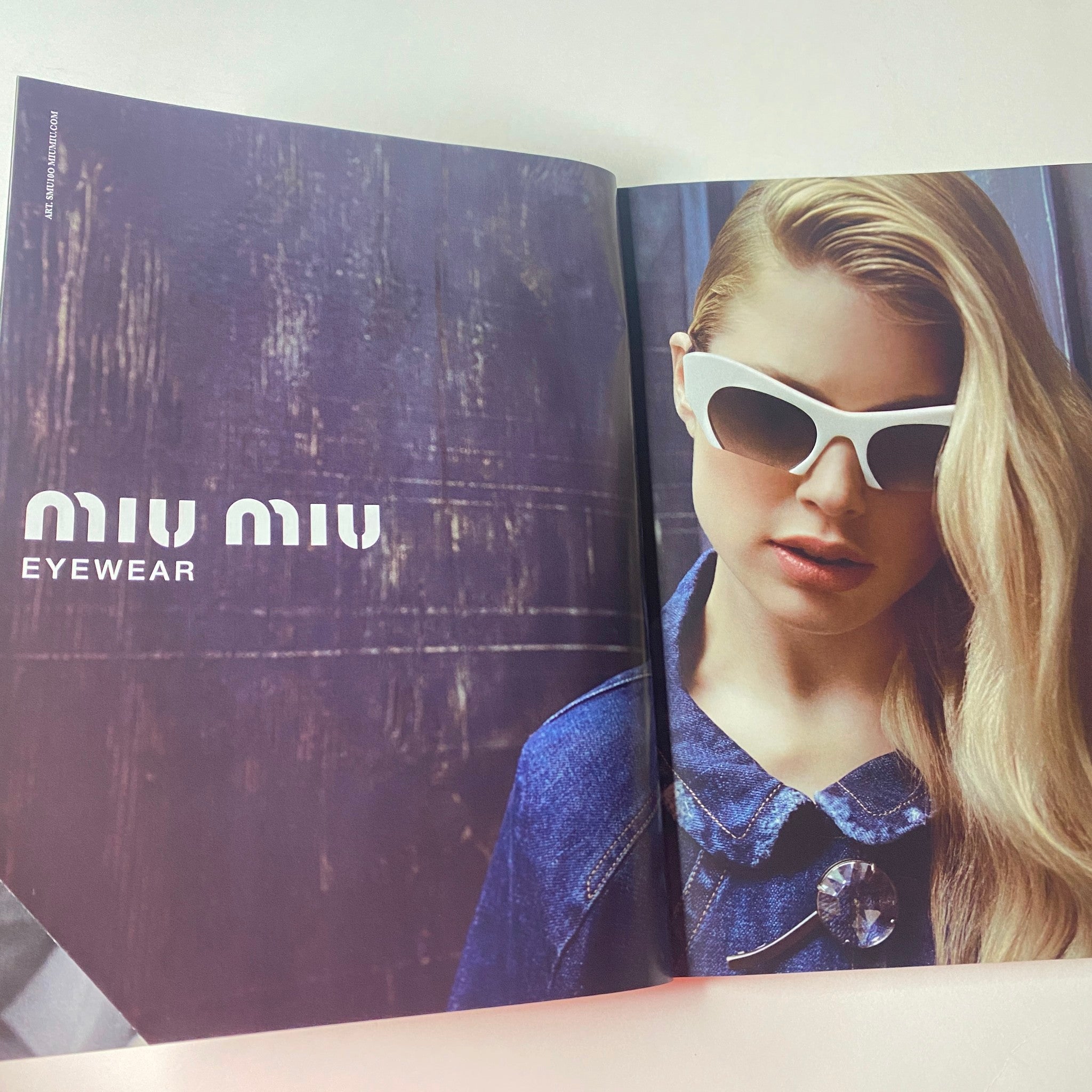 Open page from Vogue British Magazine June 2013 displaying a Miu Miu eyewear advertisement with a model in stylish sunglasses, complementing the summer fashion theme of the issue.