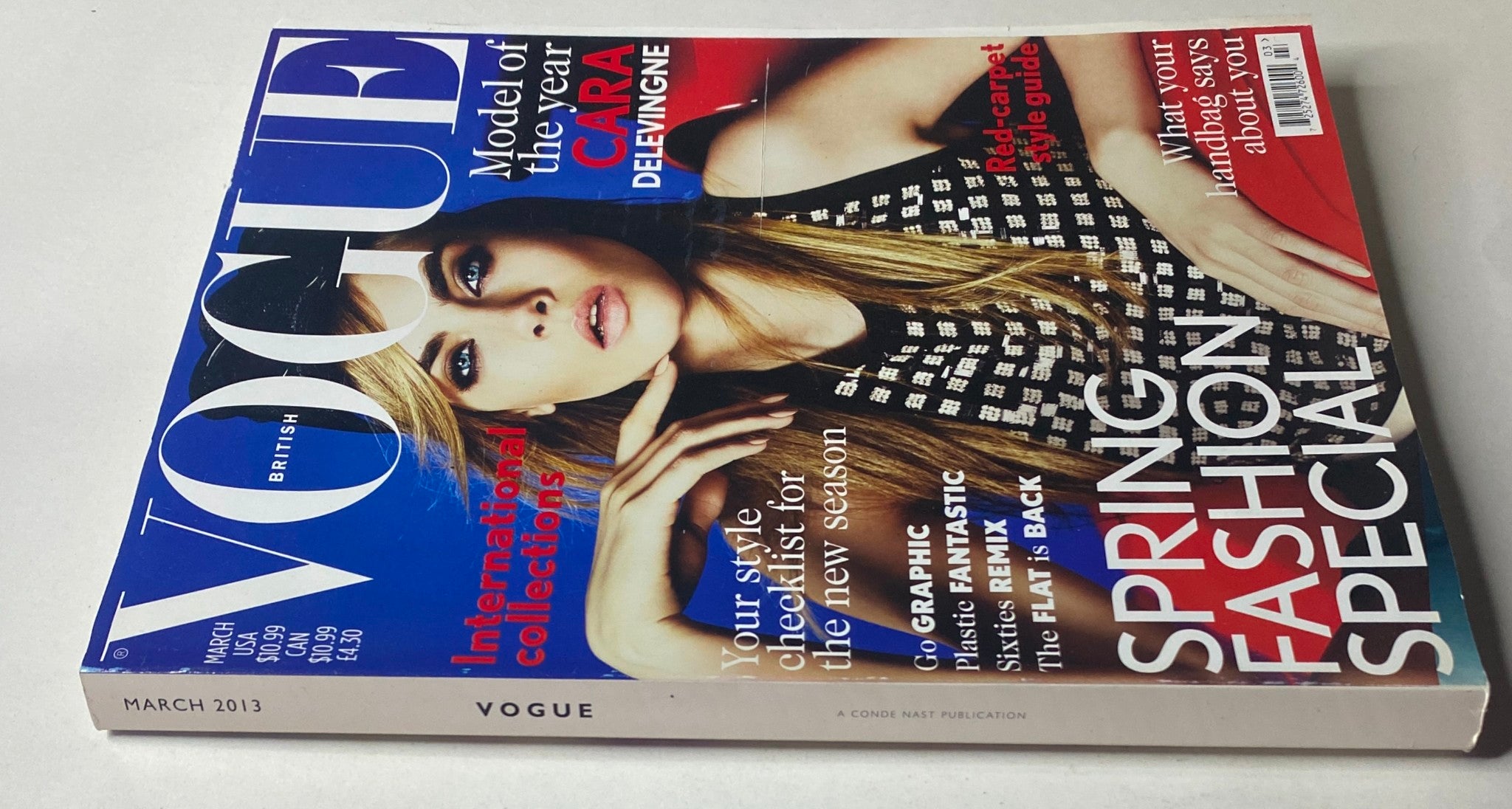 Vogue British Magazine March 2013 Cara Delevingne Cover showcasing vibrant spring fashion and bold design, highlighting the model's striking features.
