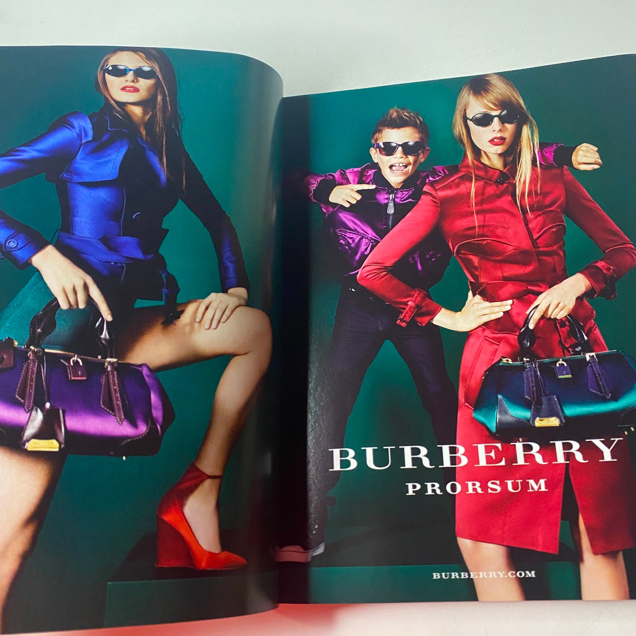 Colorful advertisement in Vogue British Magazine March 2013 for Burberry Prorsum showcasing stylish models in vibrant outfits with trendy handbags.