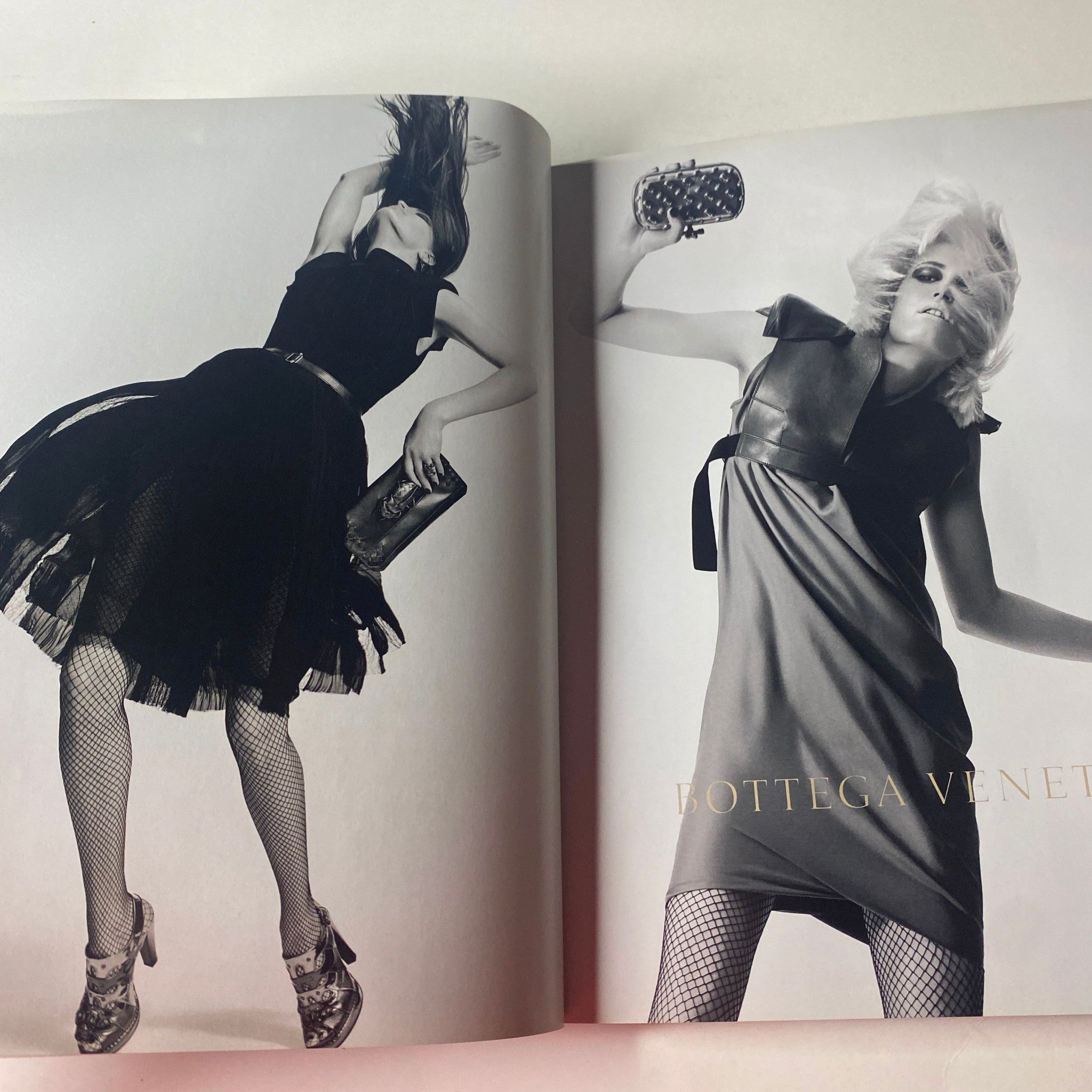 An advertisement from Vogue British Magazine October 2010 for Bottega Veneta, displaying high-fashion modeling with striking poses in elegant dresses. The spread emphasizes modern femininity and refined style.