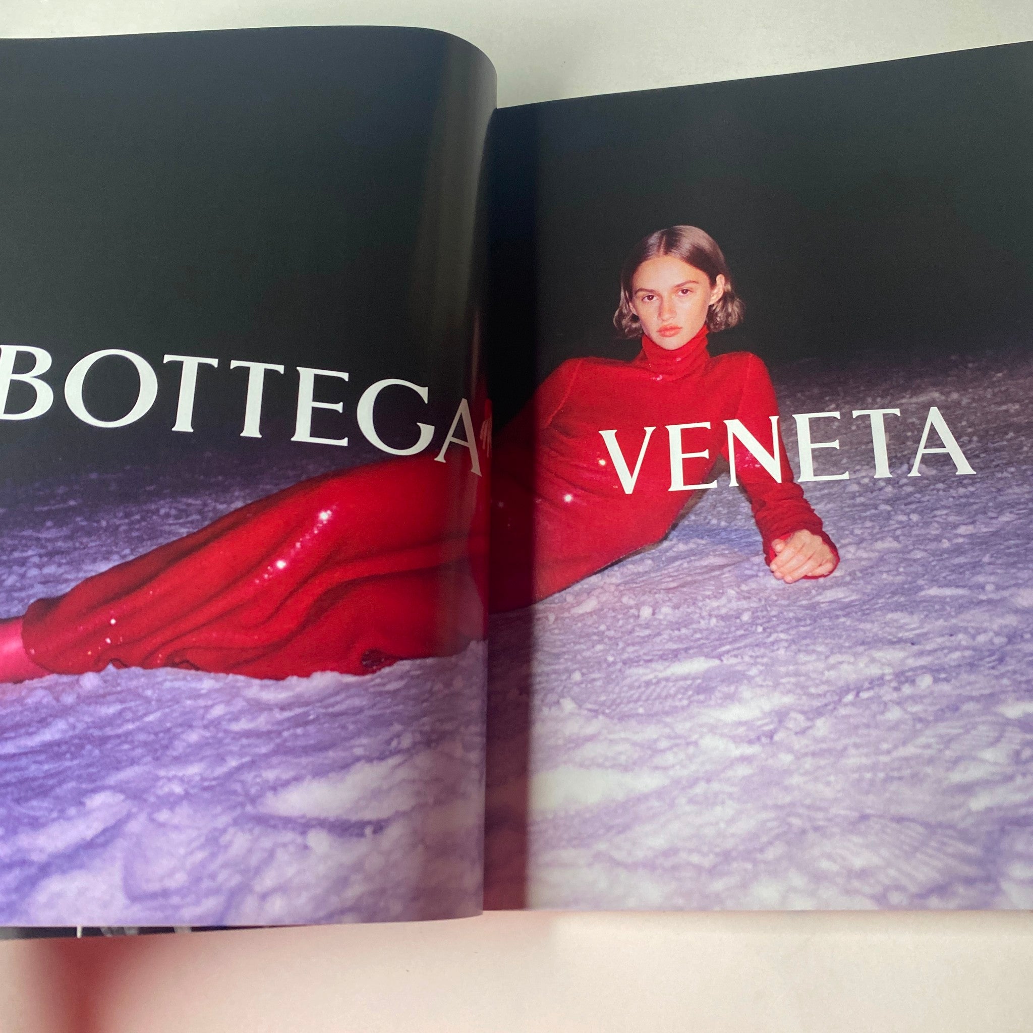 Bottega Veneta style showcased in Vogue British Magazine September 2020 featuring a model in a shimmering red outfit on a snowy backdrop.