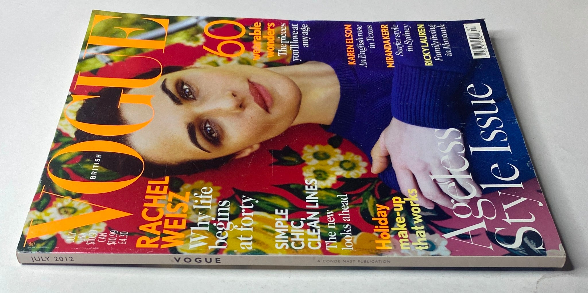 Side view of Vogue British Magazine July 2012 Rachel Weisz Cover, showcasing the unique floral background and the layout featuring bold text on fashion and style tips.