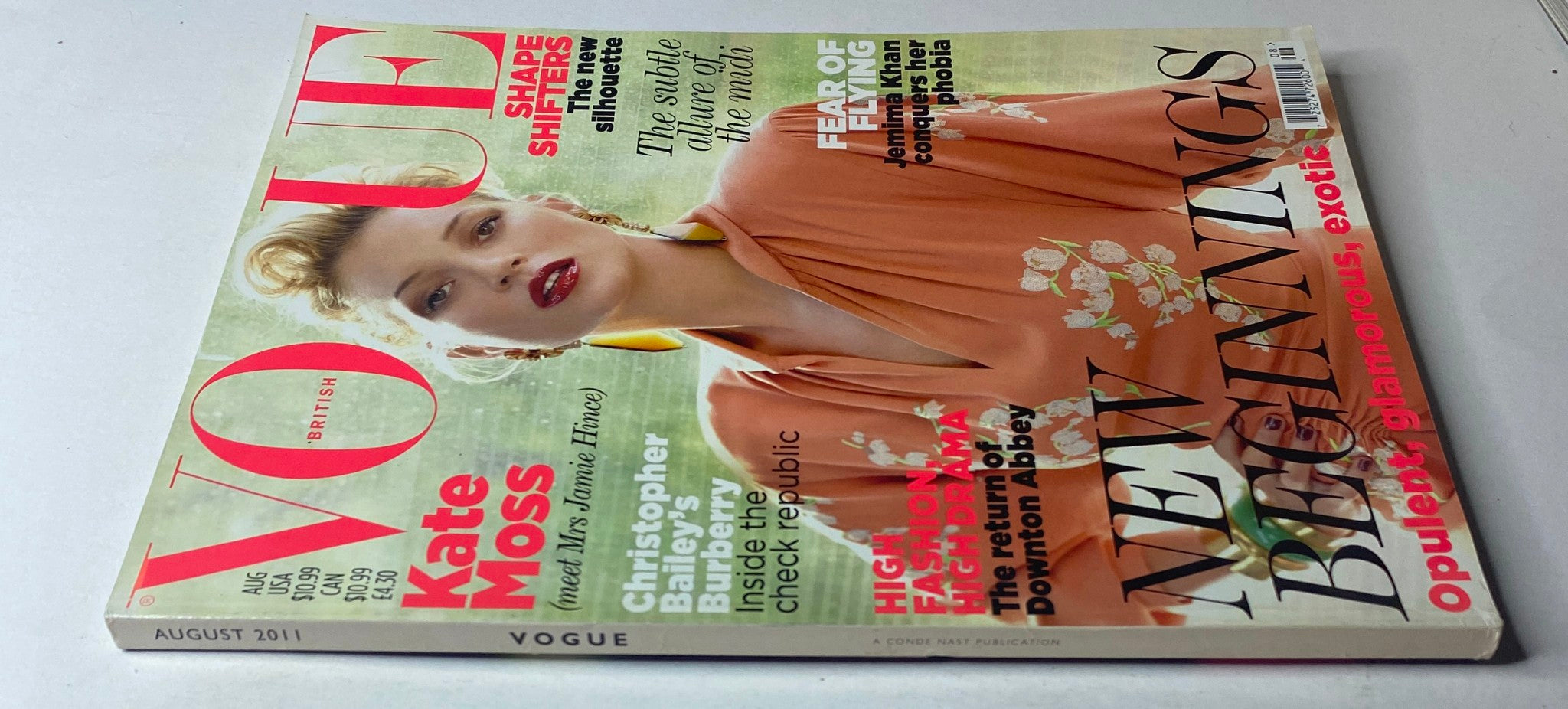 Side view of Vogue British Magazine August 2011 featuring Kate Moss on the cover, emphasizing its stylish design and collectible nature.