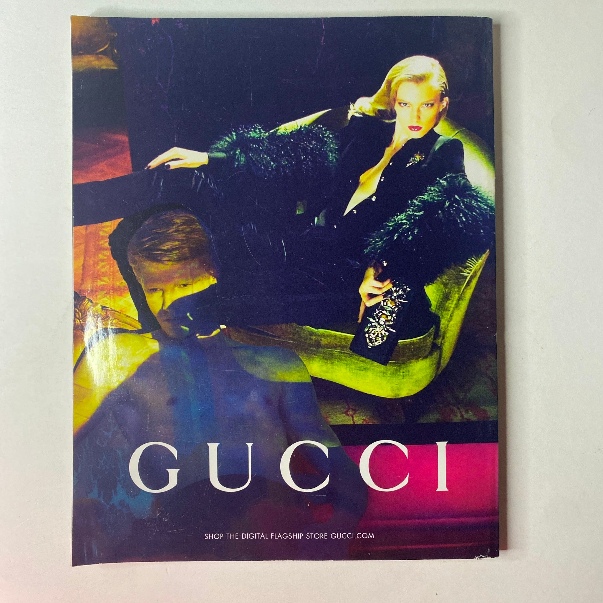 Vogue British Magazine August 2011 featuring a vibrant Gucci advertisement with a model in luxurious attire, emphasizing bold fashion and style.