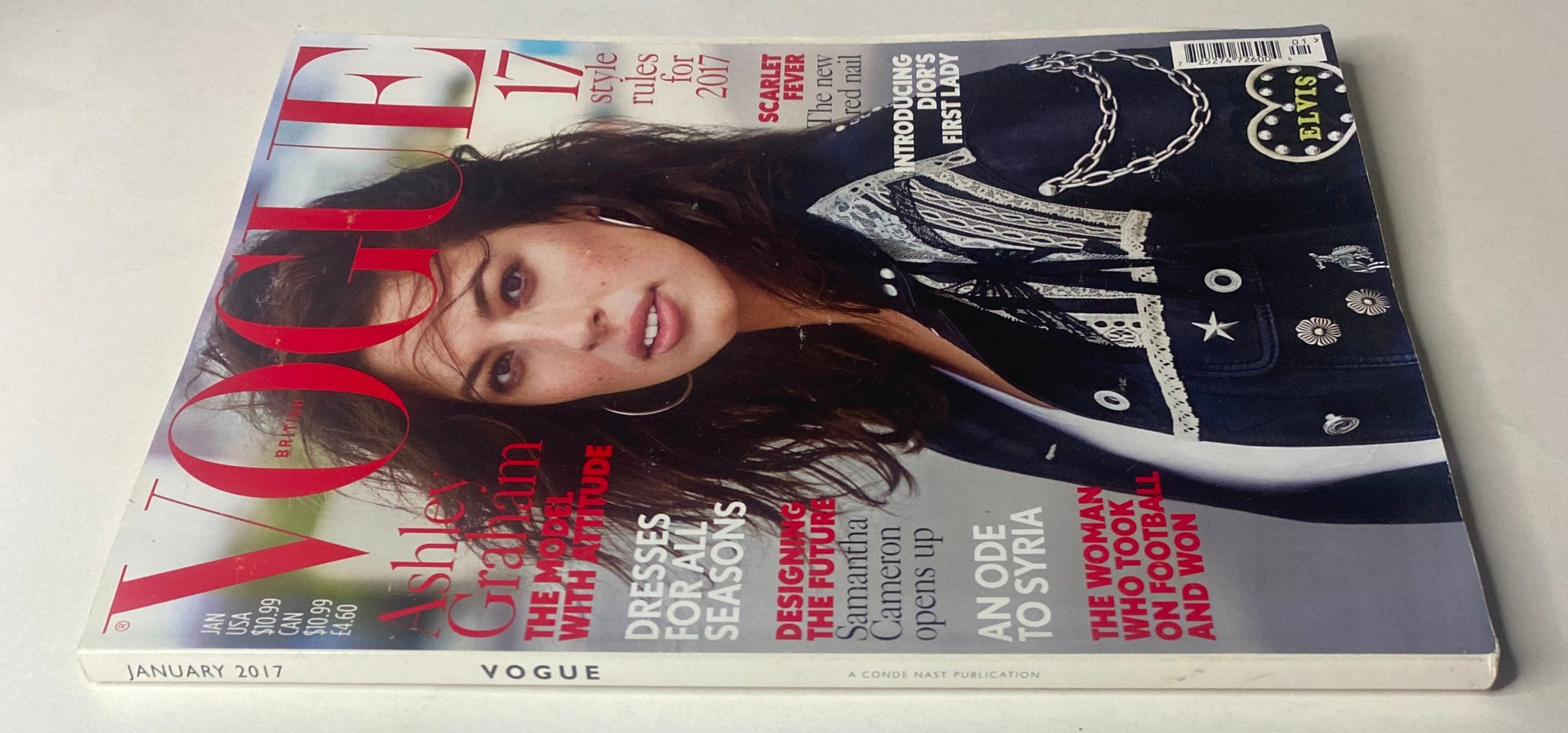 Vogue British Magazine January 2017 Ashley Graham Cover, showcasing a close-up view of the magazine cover with Ashley Graham's captivating look and bold text.