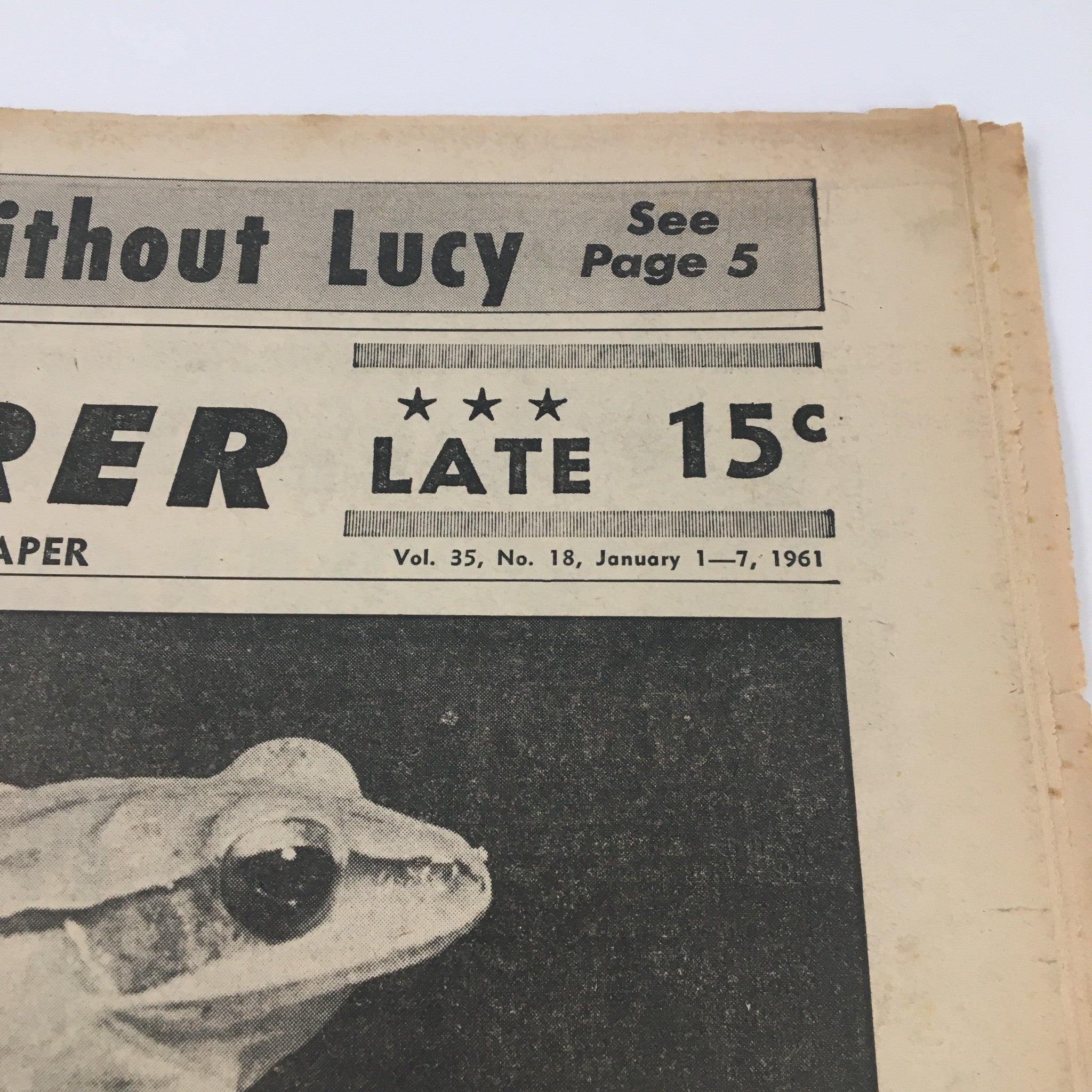 Close-up of National Enquirer Paper January 1 1961 featuring a frog and the price of 15 cents, indicating the publication's age.