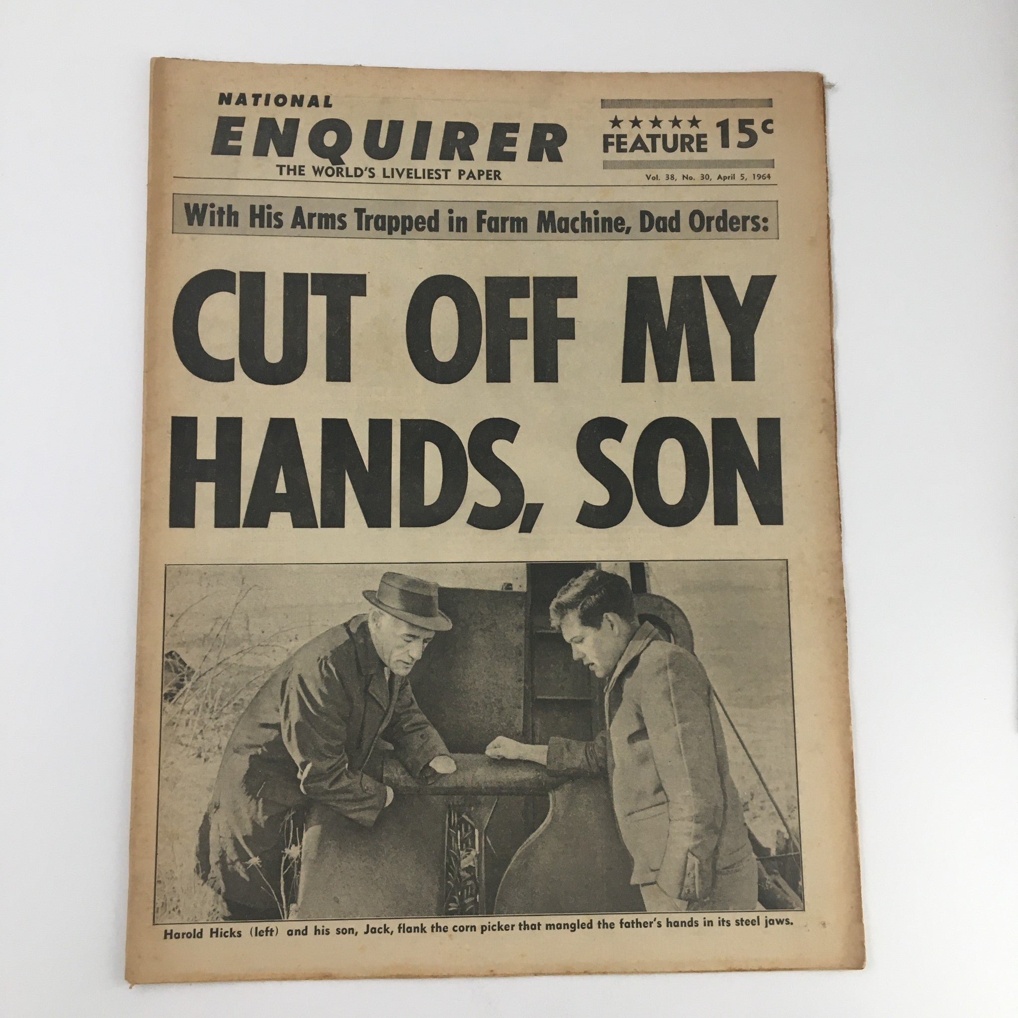 April 5, 1964 National Enquirer Newspaper featuring Harold Hicks and his son Jack in a farm setting, highlighting the headline 'Cut Off My Hands, Son.' A vintage piece capturing moments from family life and farming in the 1960s.