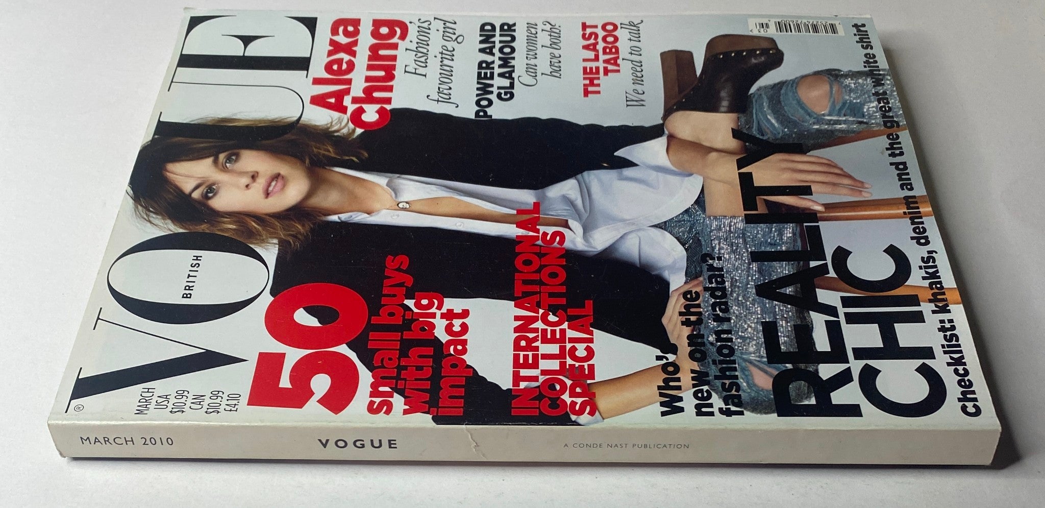 Side view of Vogue British Magazine March 2010 showcasing a close-up of the magazine's spine and cover details with Alexa Chung. Highlights include coverage on small buys with big impact and fashion radar insights.