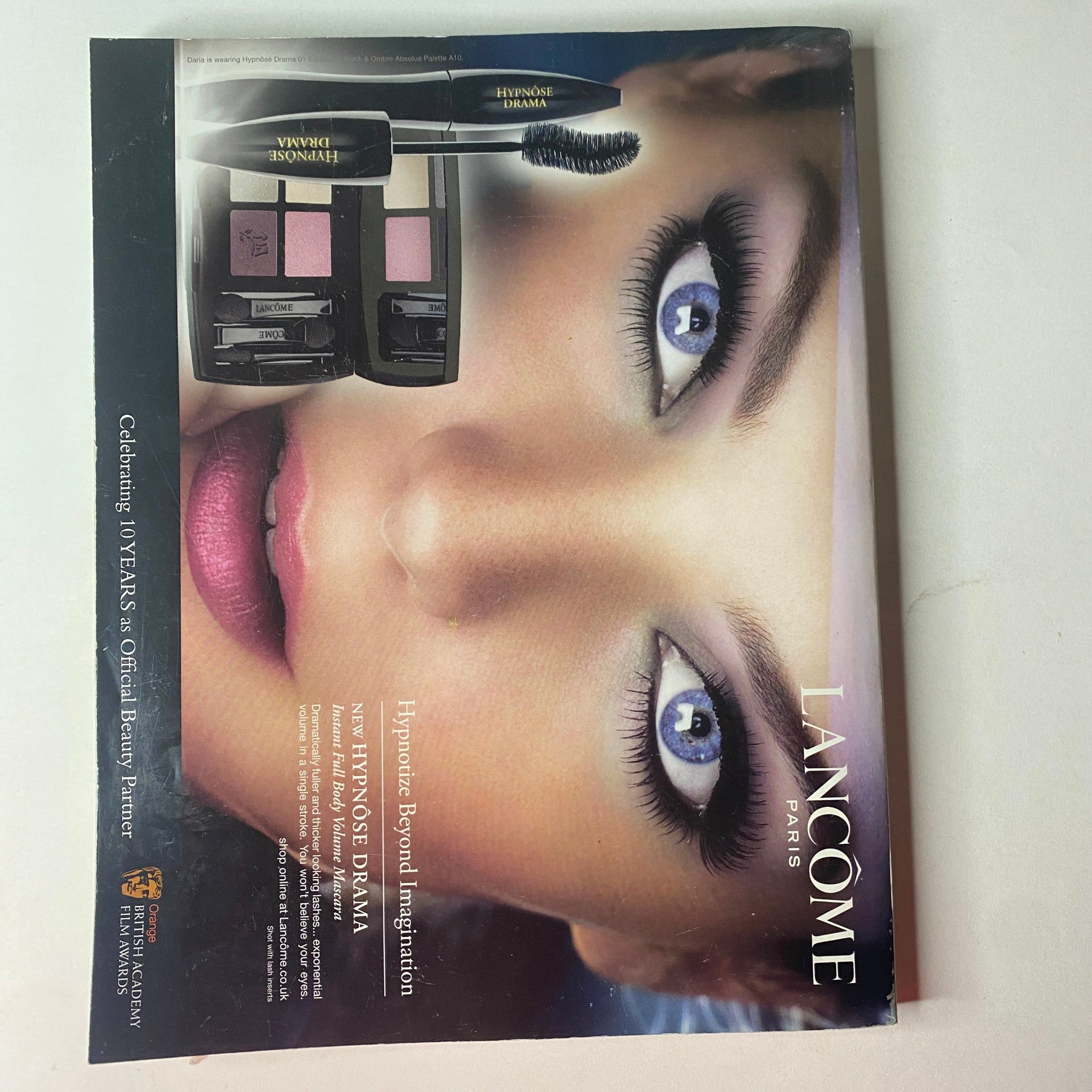 Vogue British Magazine March 2010 featuring a Lancôme advertisement highlighting makeup products with a focus on stunning eye makeup.