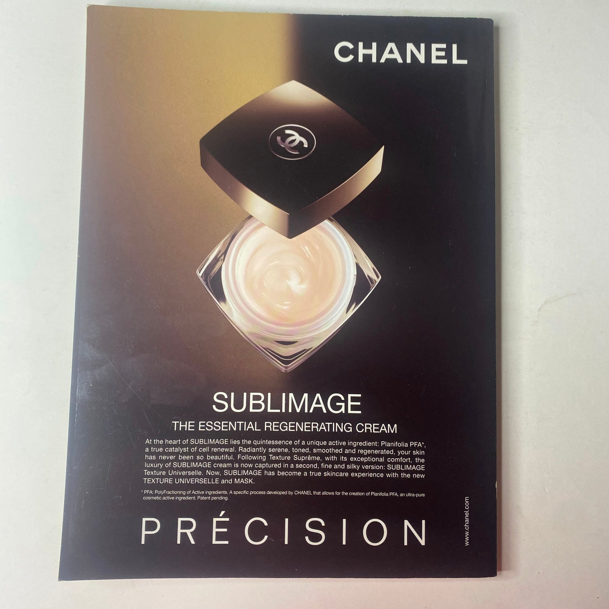 Chanel Sublimage product advertisement, showcasing the essential regenerating cream in a visually appealing layout, featuring a sleek black and white aesthetic, promoting luxury skincare that emphasizes rejuvenating skin care properties.
