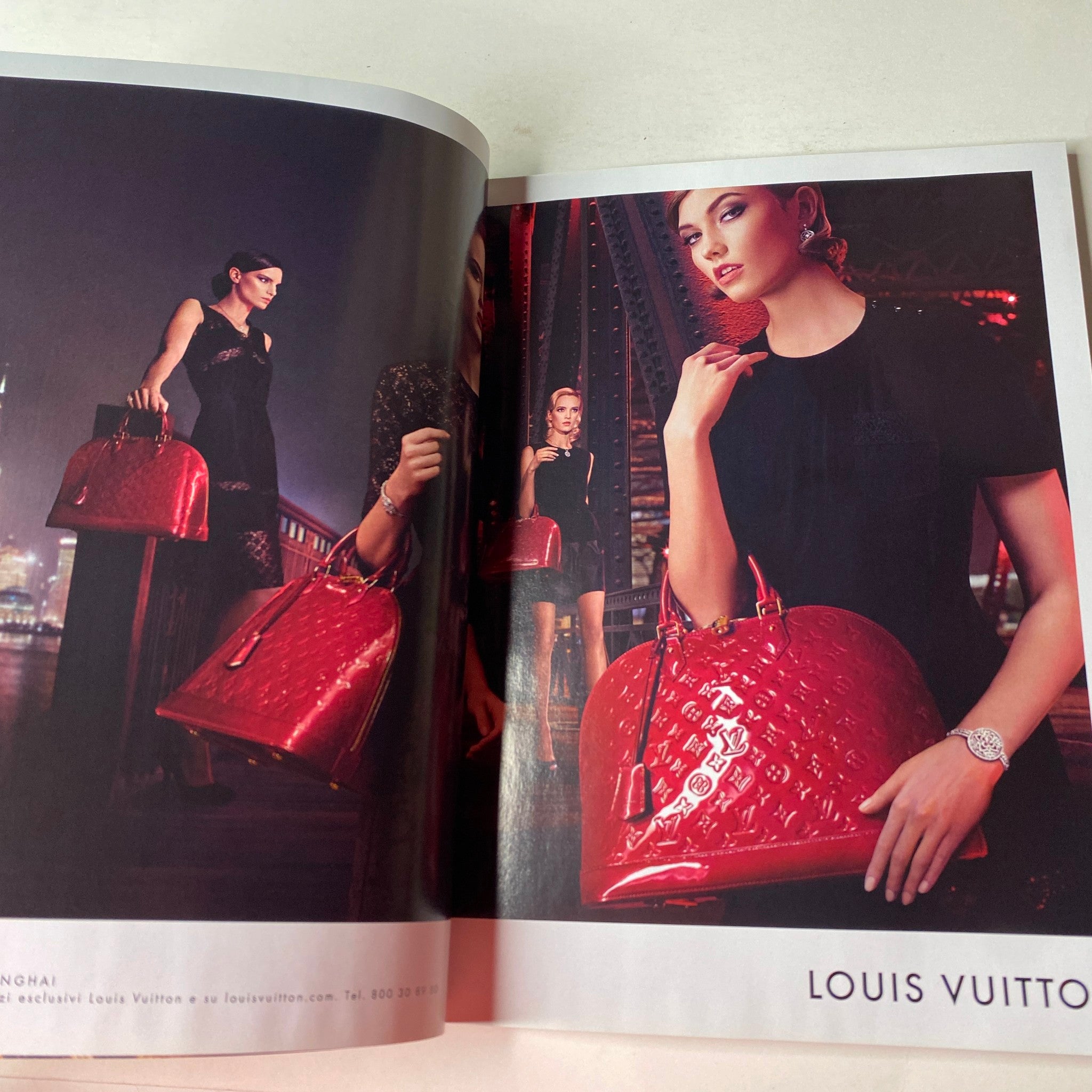 Ad campaign in Vogue Italia Magazine June 2013 No. 754 featuring a model with Louis Vuitton bags, reflecting modern luxury and style.