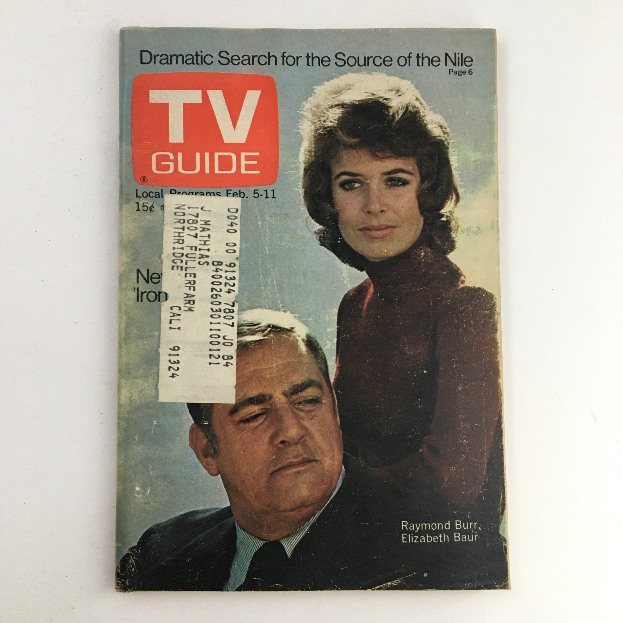Cover of TV Guide Magazine February 5, 1972 featuring Raymond Burr and Elizabeth Baur. Highlights the iconic actors in a nostalgic setting, capturing a moment in television history.