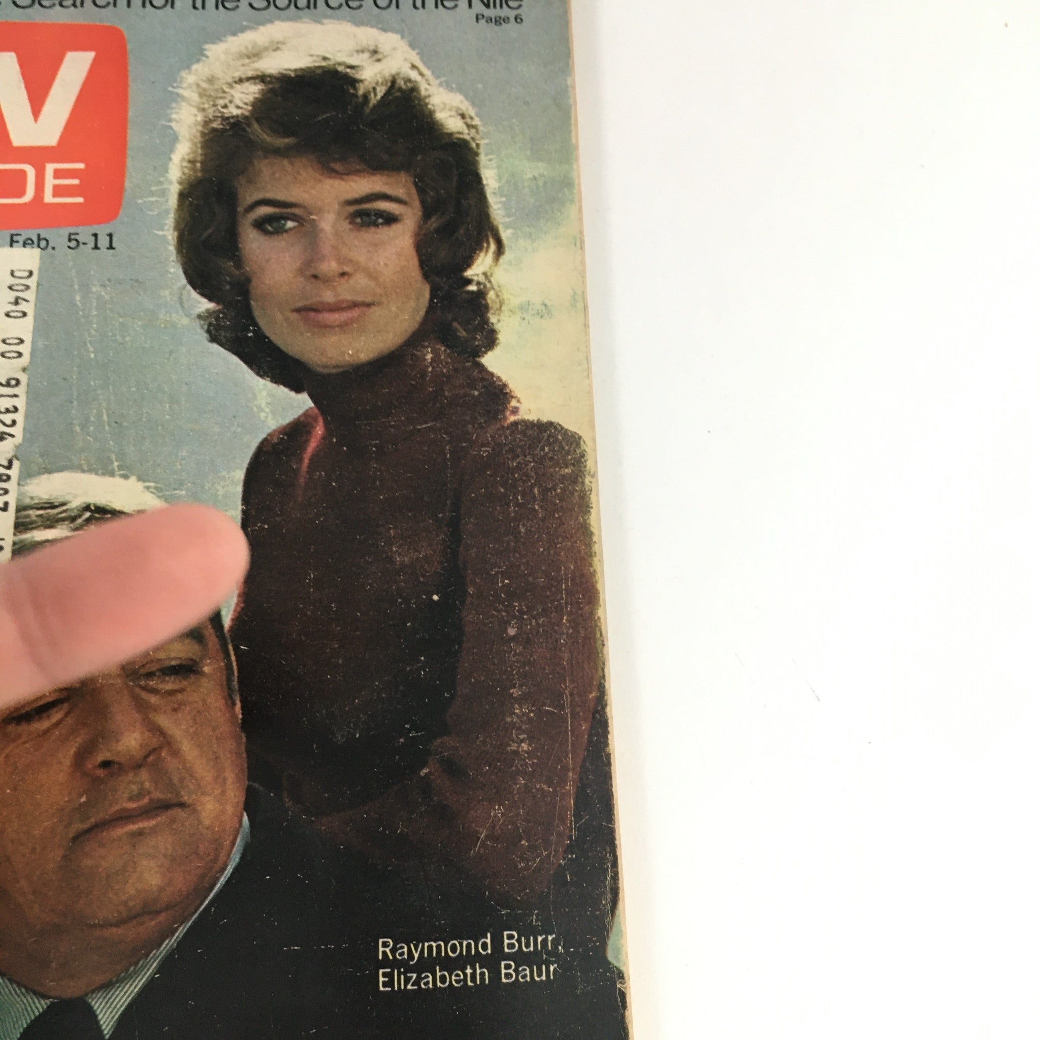 Close-up of the TV Guide Magazine February 5, 1972 cover showing Raymond Burr and Elizabeth Baur. Focuses on their expressions and the magazine's vintage appeal.