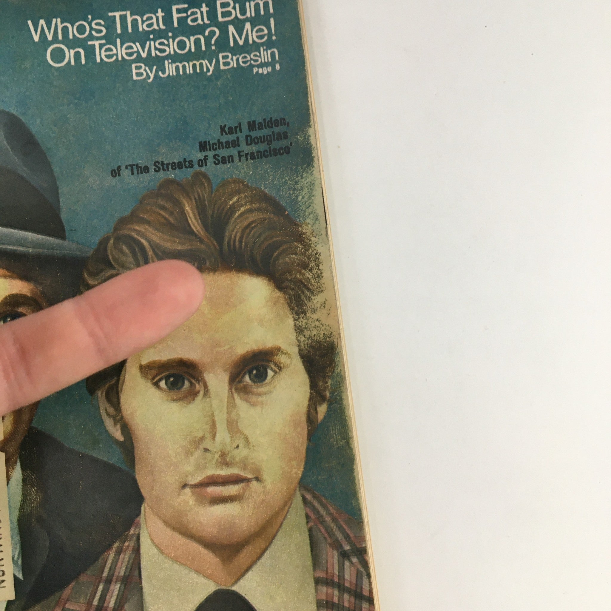 Close-up of the cover of TV Guide Magazine May 26, 1973 highlighting Karl Maden and Michael Douglas with a finger pointing at the image.