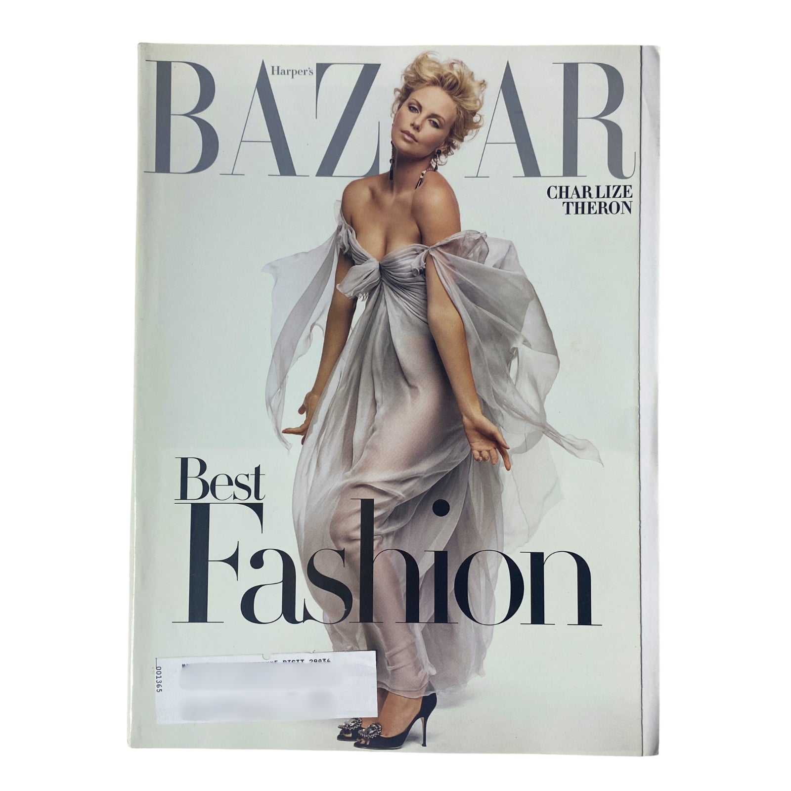 Cover of Harper's Bazaar Magazine, October 2005 issue featuring Charlize Theron in elegant attire, showcasing high fashion and modern glamour.