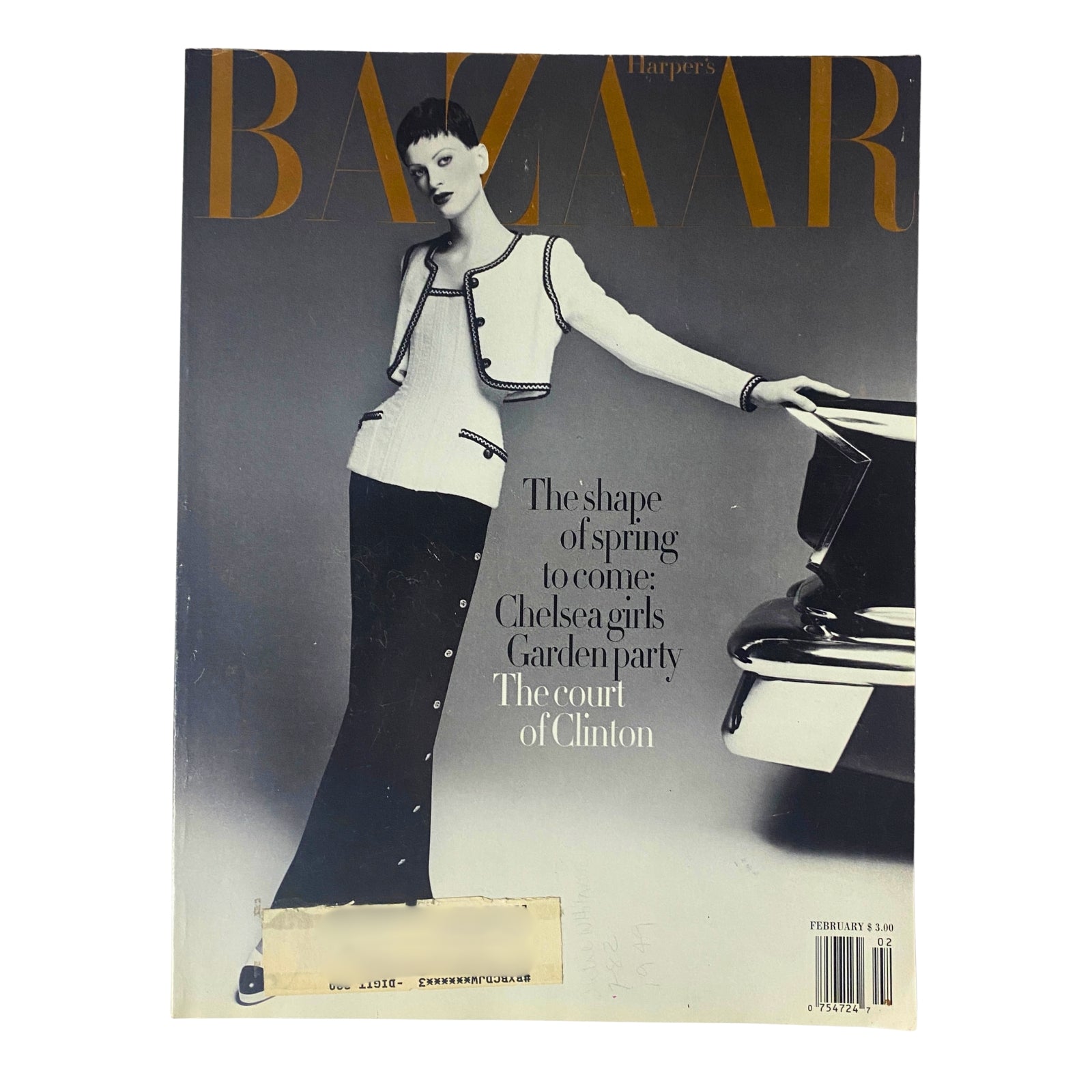 Cover of Harper's Bazaar Magazine February 1993 featuring Kristen McMenamy in a chic Chanel ensemble, showcasing minimalist fashion with bold editorial styling.