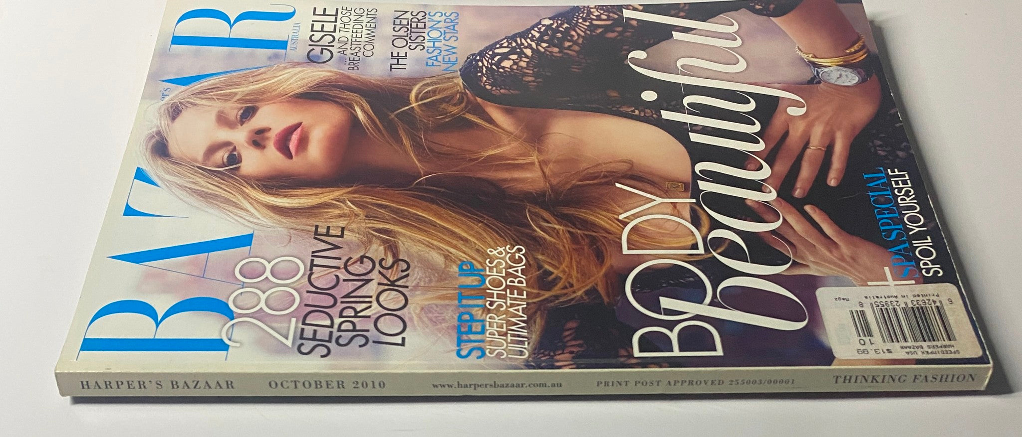 Side view of Harper's Bazaar Australia Magazine October 2010 cover showcasing Gisele Bündchen, highlighting the issue's emphasis on seductive spring looks and fashion trends.