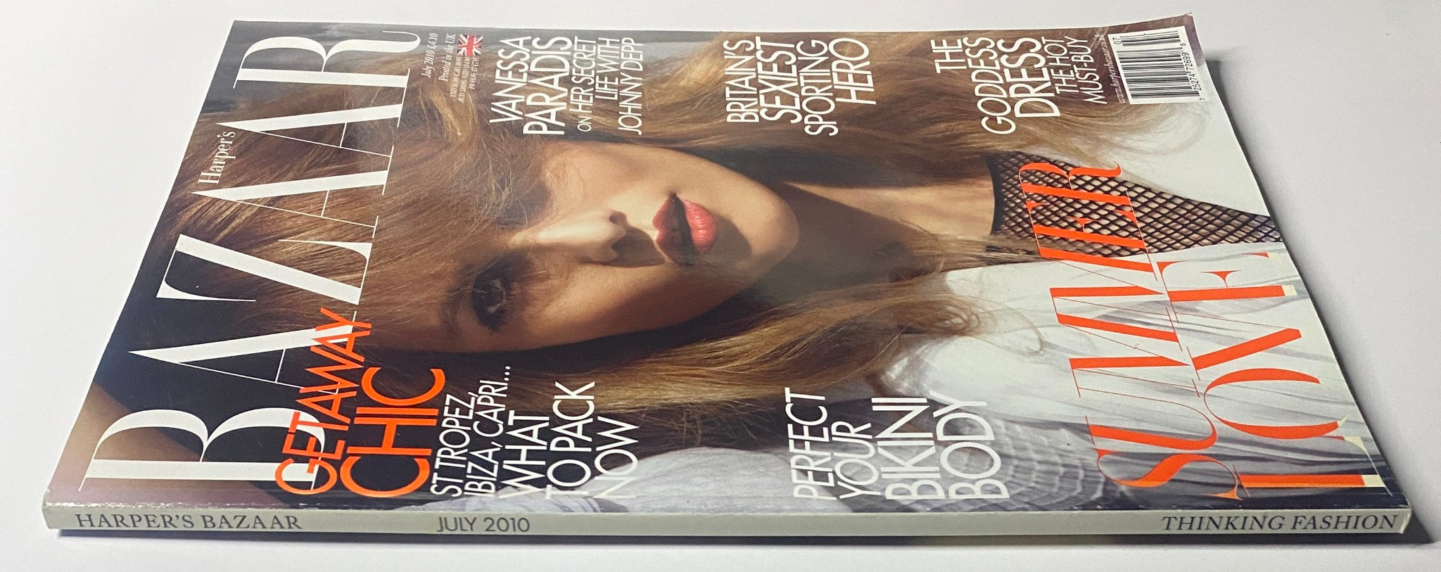 Side view of Harper's Bazaar UK Magazine July 2010 with Vanessa Paradis on the cover, showcasing summer fashion trends.