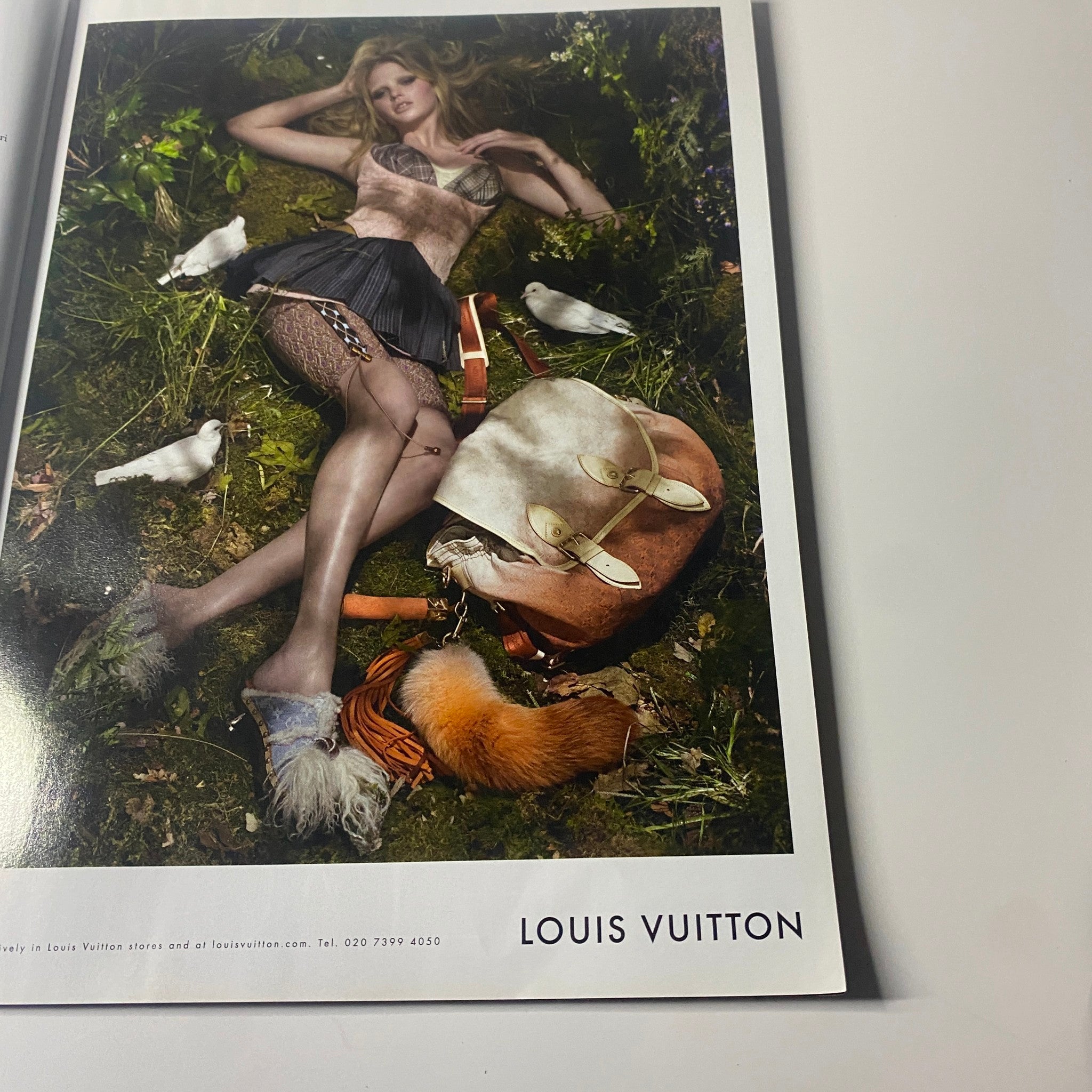 Advertisement page from Harper's Bazaar UK Magazine July 2010 showcasing a Louis Vuitton campaign, highlighting luxury fashion.