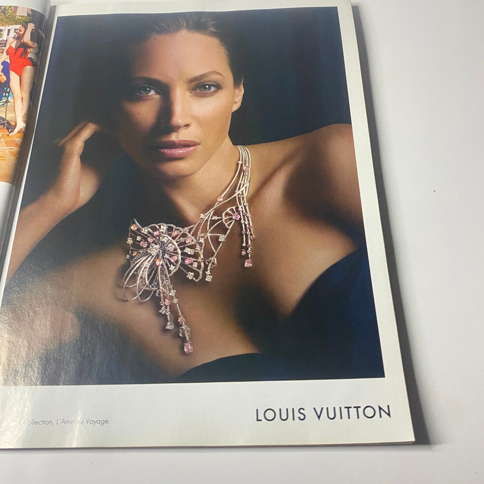 Image from Harper's Bazaar UK Magazine July 2011 featuring an advertisement for Louis Vuitton showcasing a model wearing elegant jewelry.