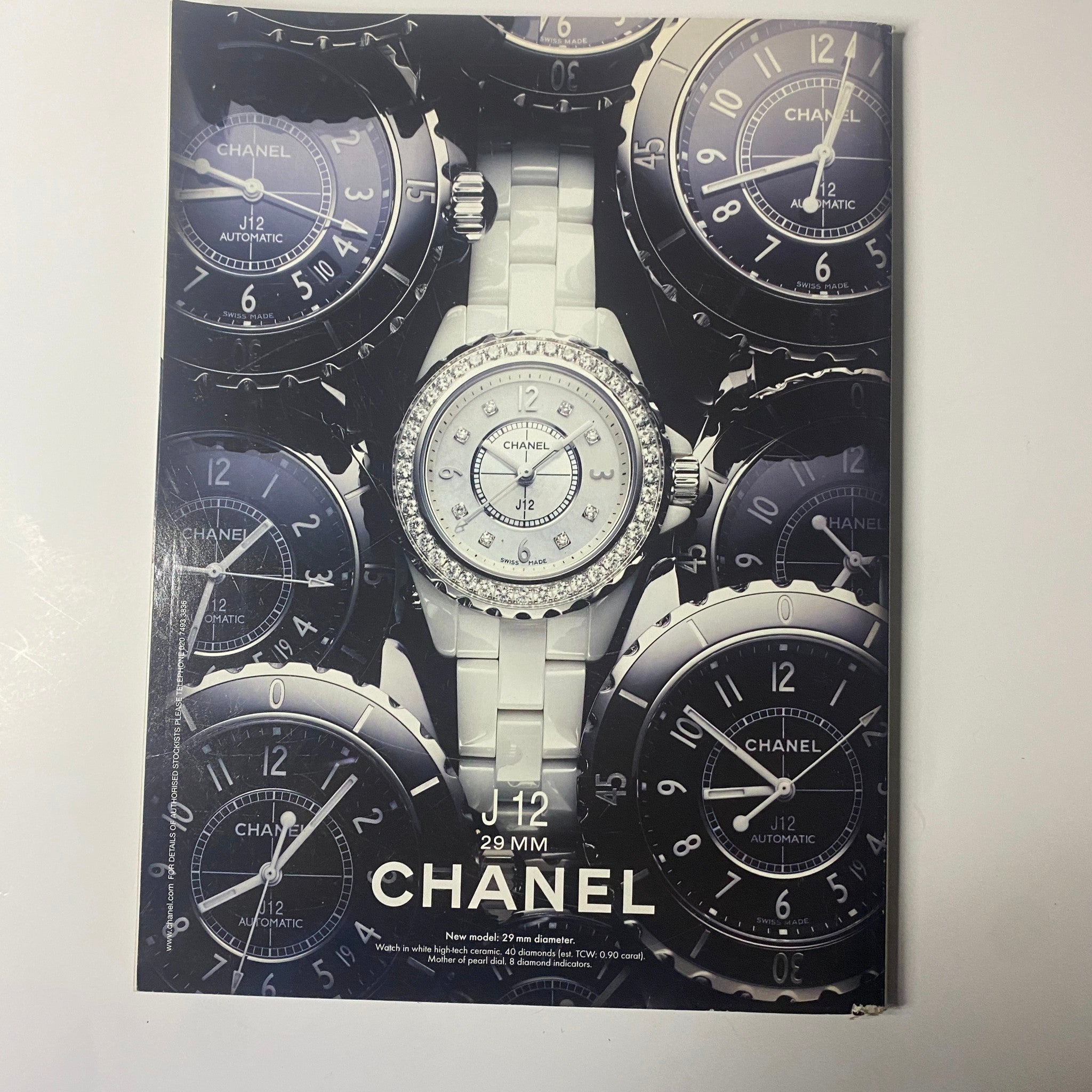 Harper's Bazaar UK Magazine June 2011 showcasing a luxurious Chanel J12 watch surrounded by a collection of timepieces, highlighting contemporary luxury and fashion.