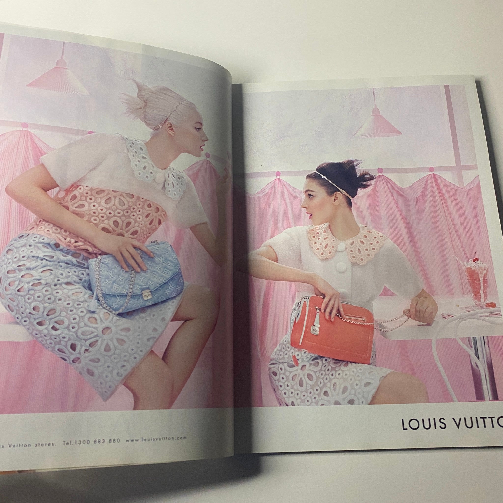 Harper's Bazaar Australia Magazine May 2012 featuring two models in Louis Vuitton fashion, showcasing high-fashion looks in a colorful and artistic presentation.