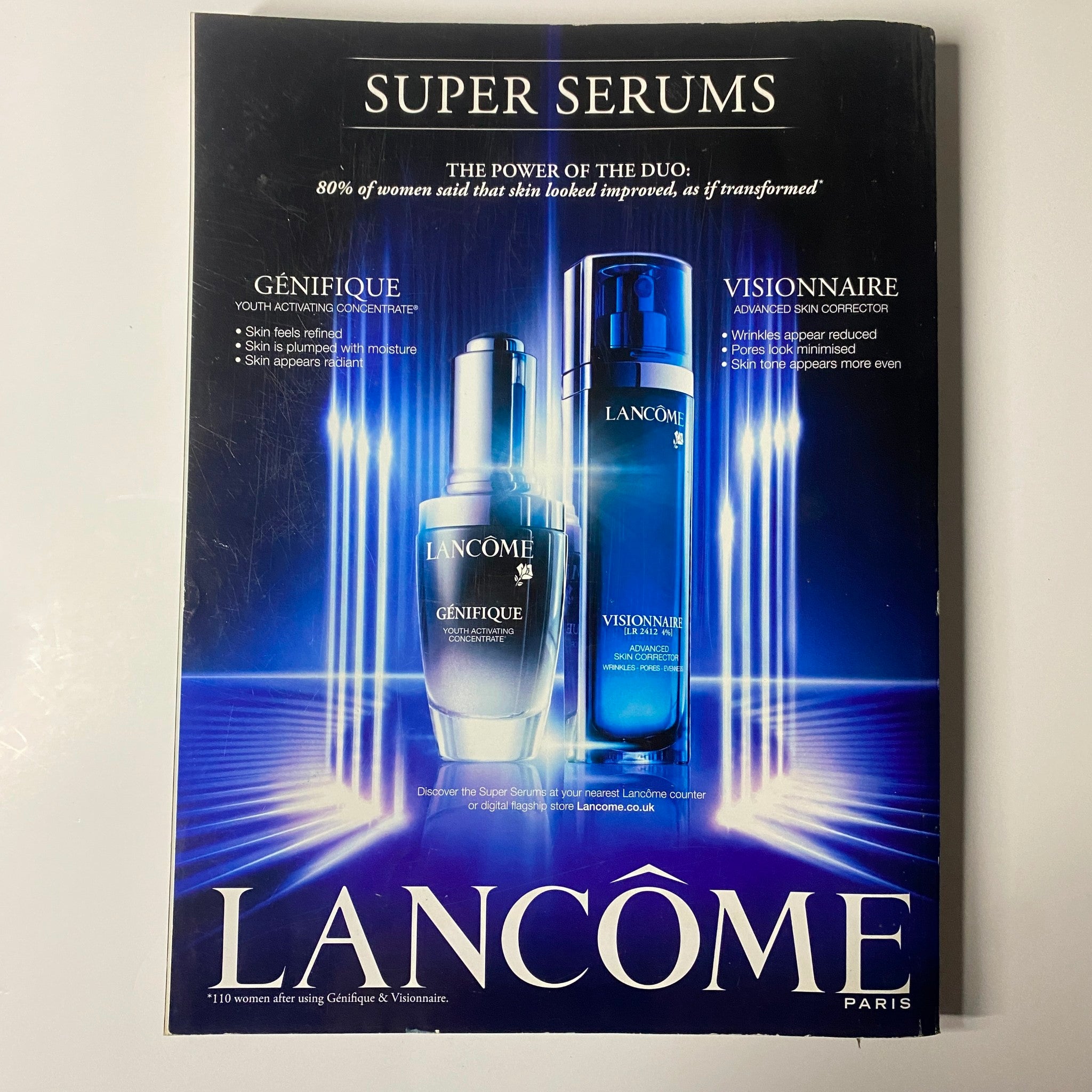 Advertisement for Lancôme featuring Super Serums, Genifique and Visionnaire, highlighting skincare benefits, from Harper's Bazaar UK Magazine March 2013 Rachel Weisz Cover.
