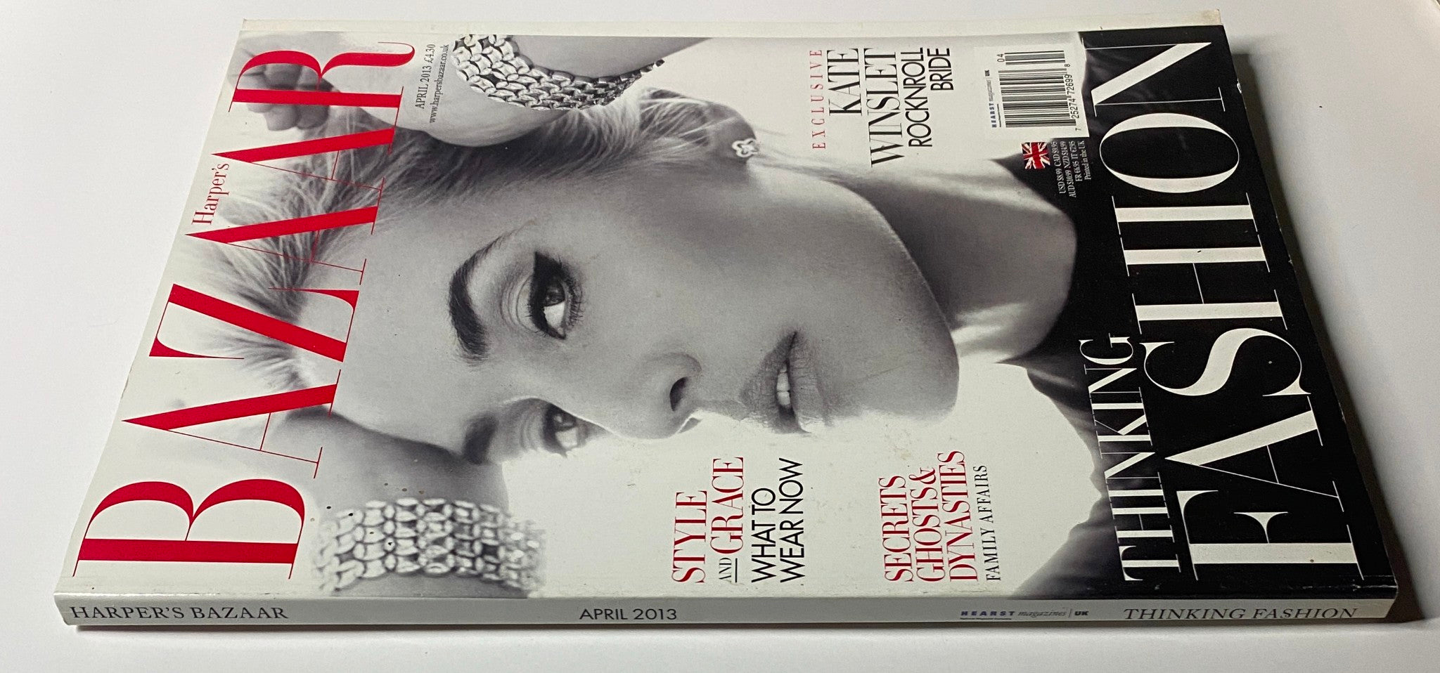 Harper's Bazaar UK Magazine April 2013 Kate Winslet Cover - Close-up view of the magazine, showcasing Kate Winslet's captivating look, emphasizing fashion and beauty themes present in the issue.